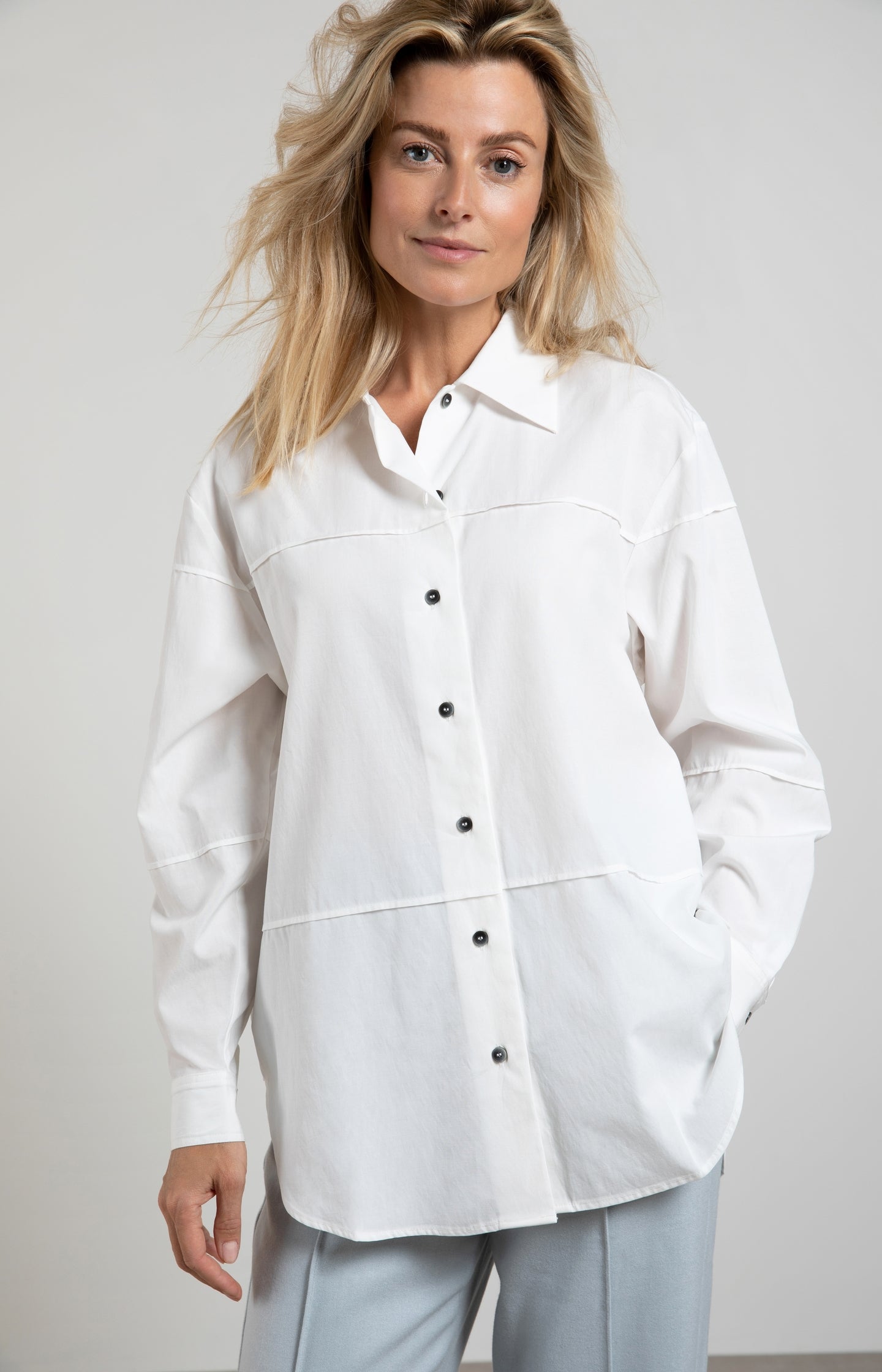 Oversized blouse with long sleeves, buttons and seam details