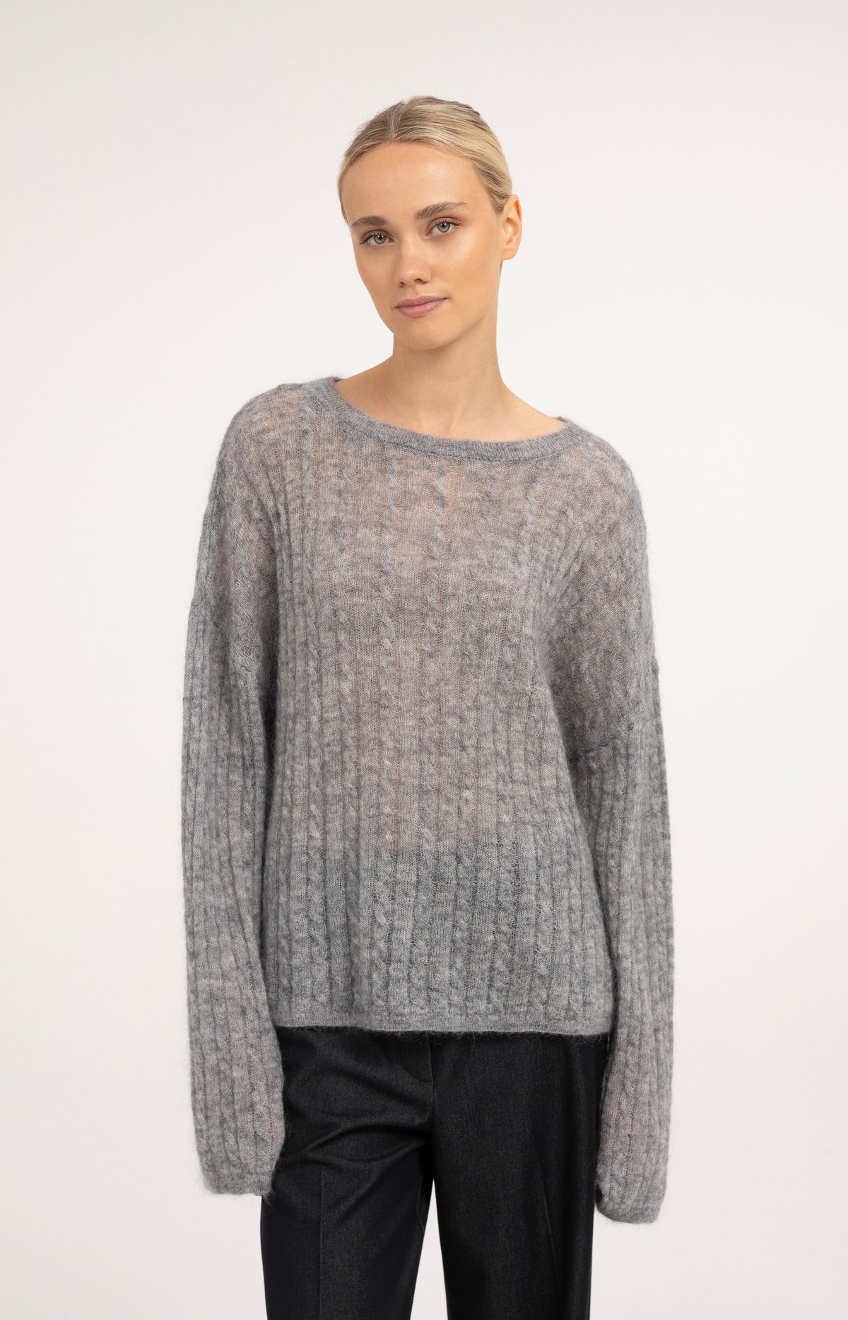 Oversized cable sweater with boat neckline
