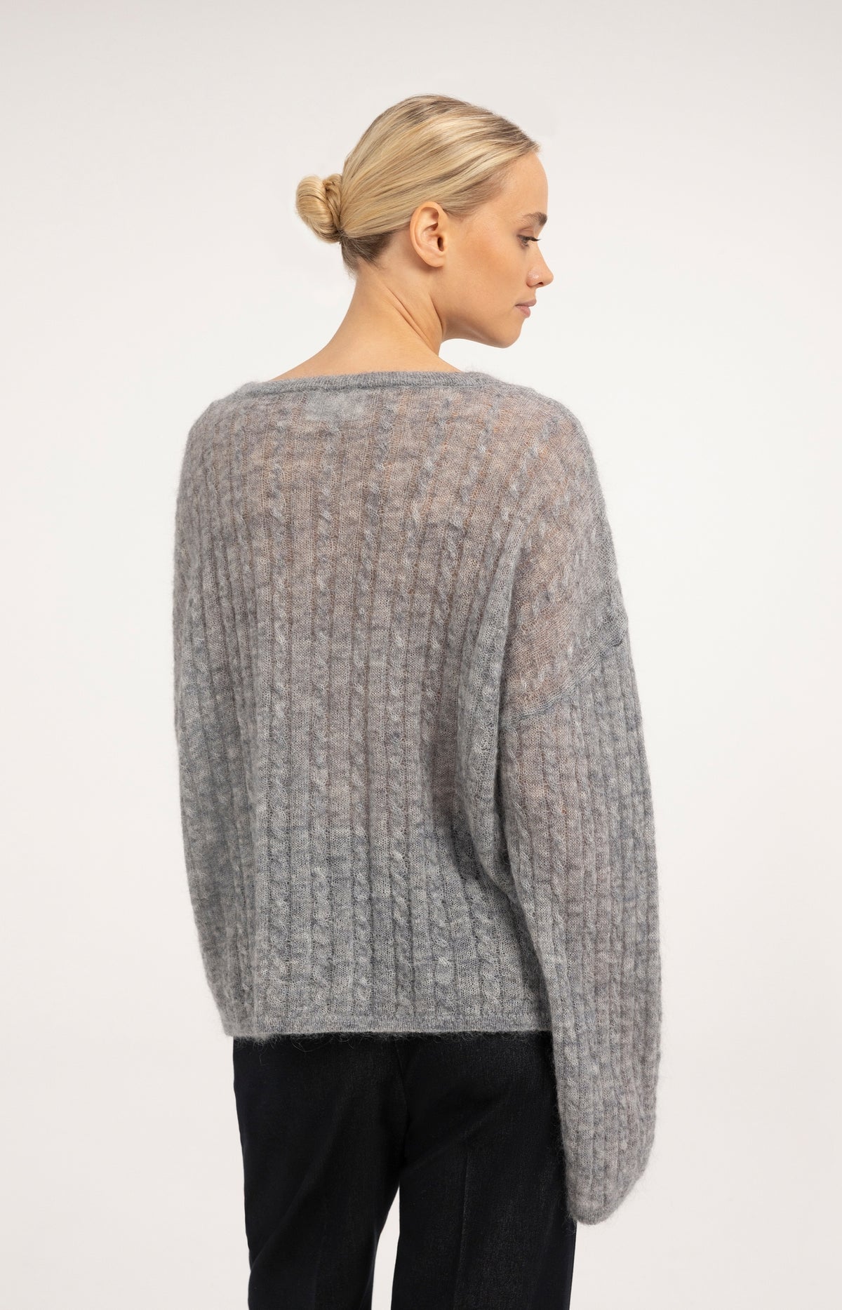 Oversized cable sweater with boat neckline