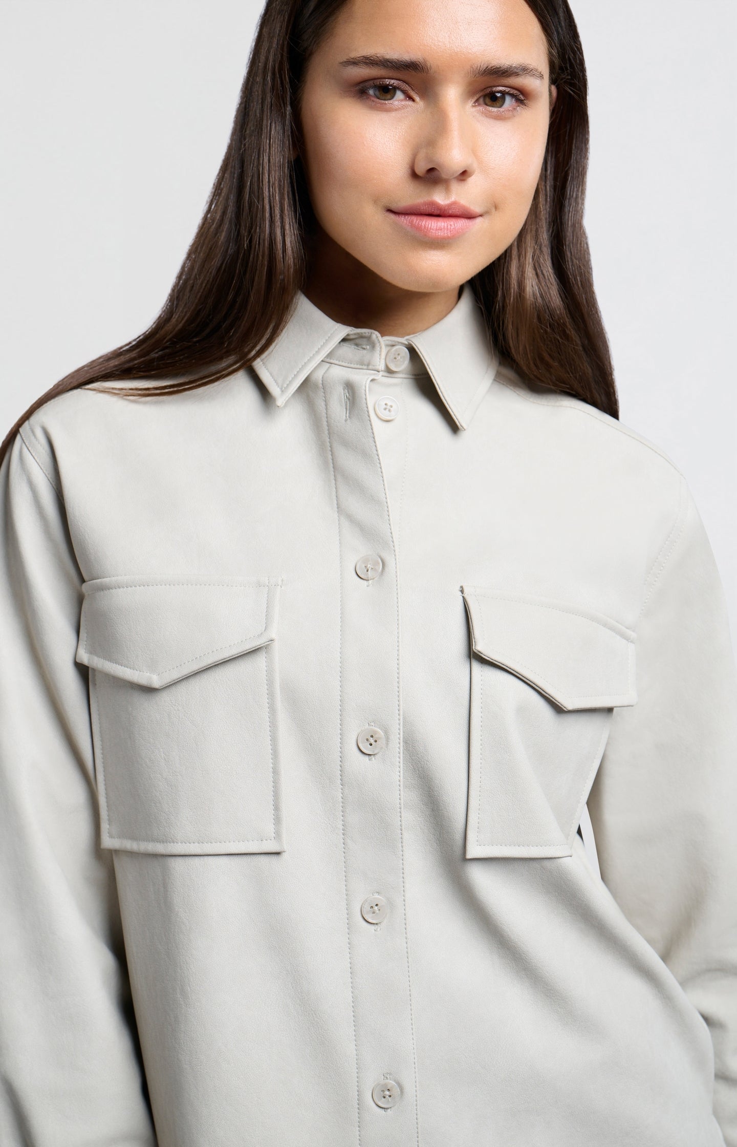 Oversized faux leather blouse with collar and long sleeves