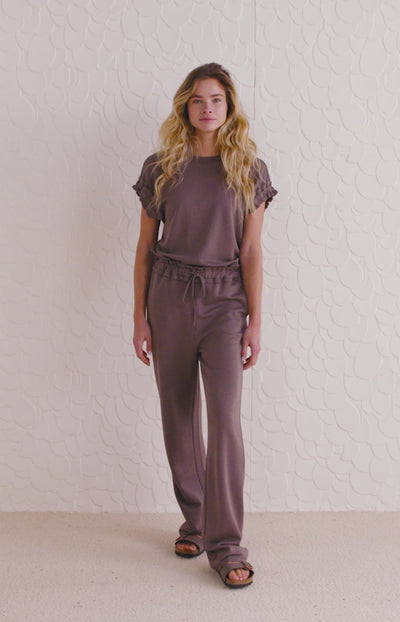 Jersey trousers with ruffled waist and side pockets