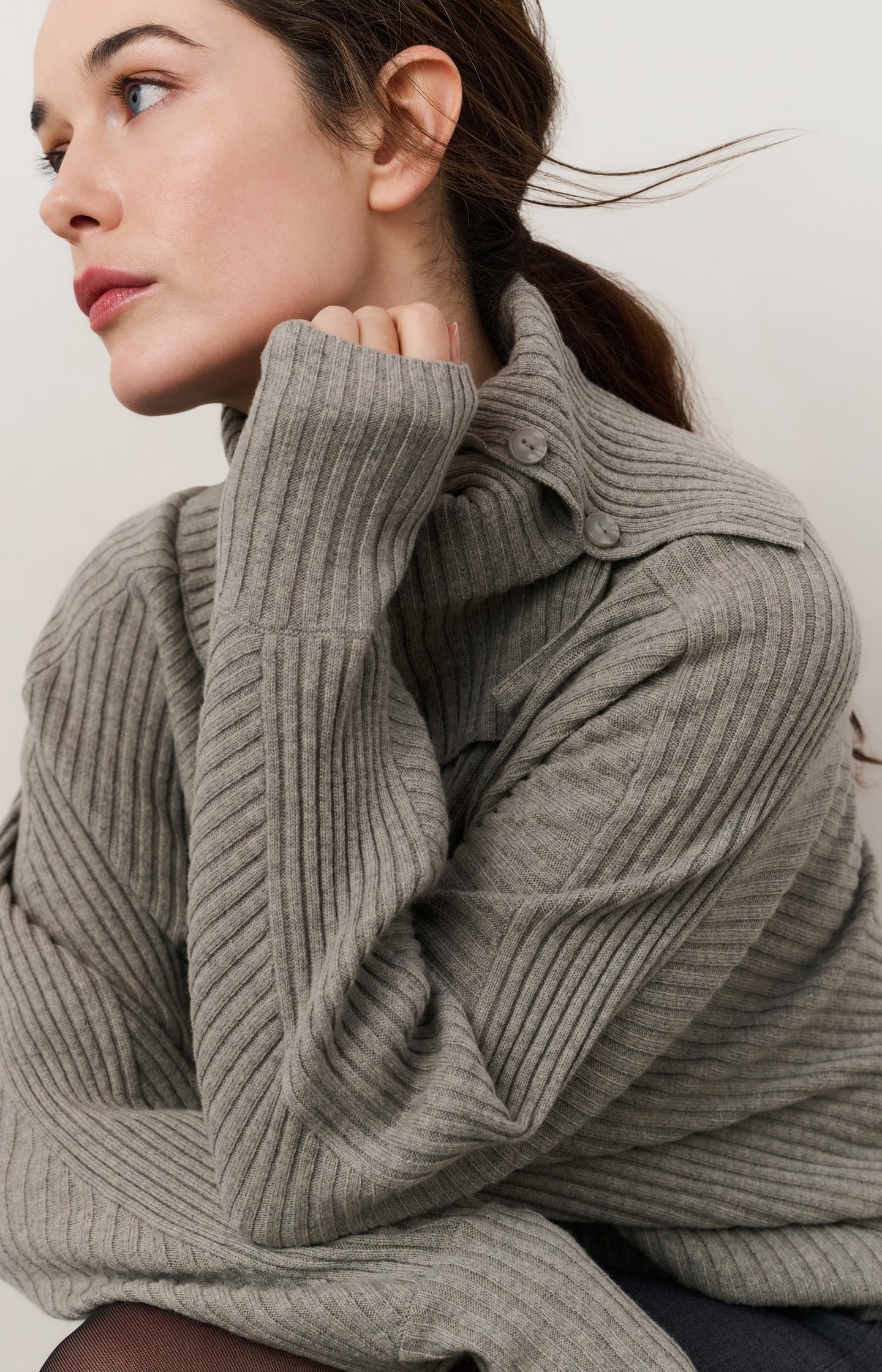 Ribbed sweater with batwing sleeves and high collar