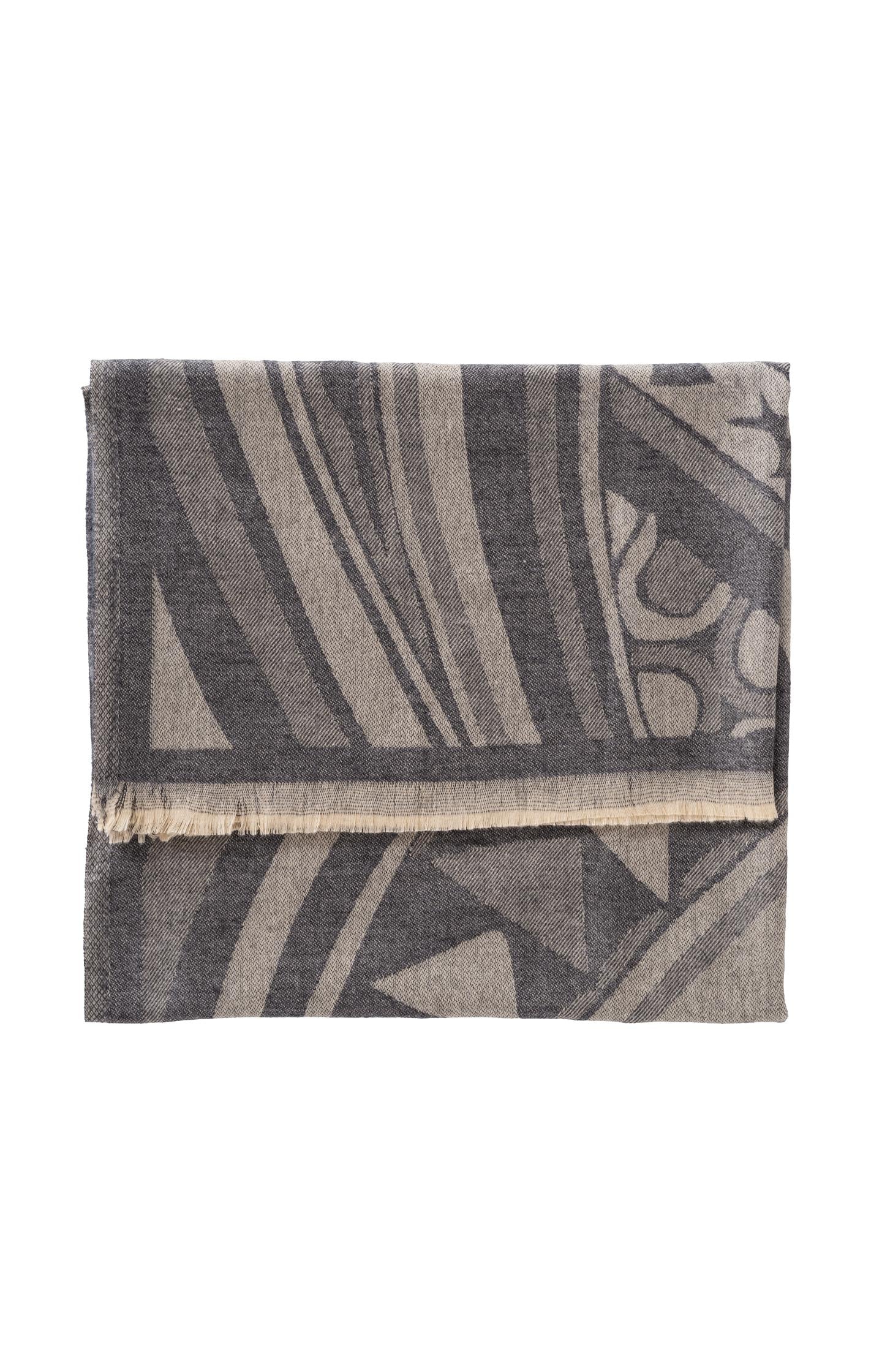 Scarf with a subtle abstract print and delicate fringes