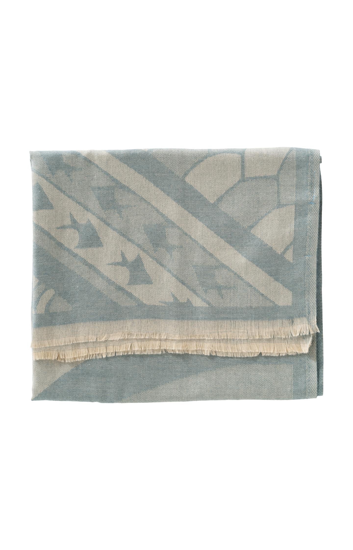 Scarf with a subtle abstract print and delicate fringes