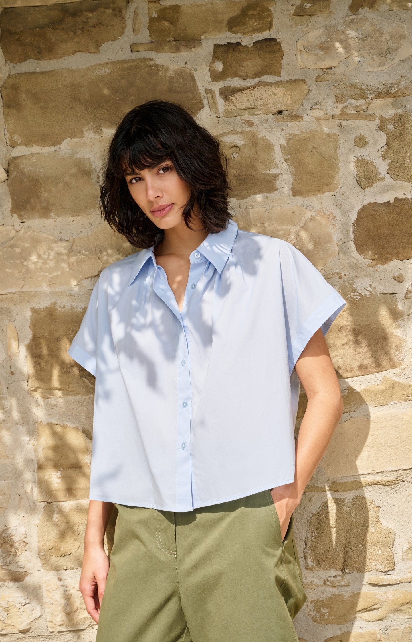 Sleeveless blouse with button details