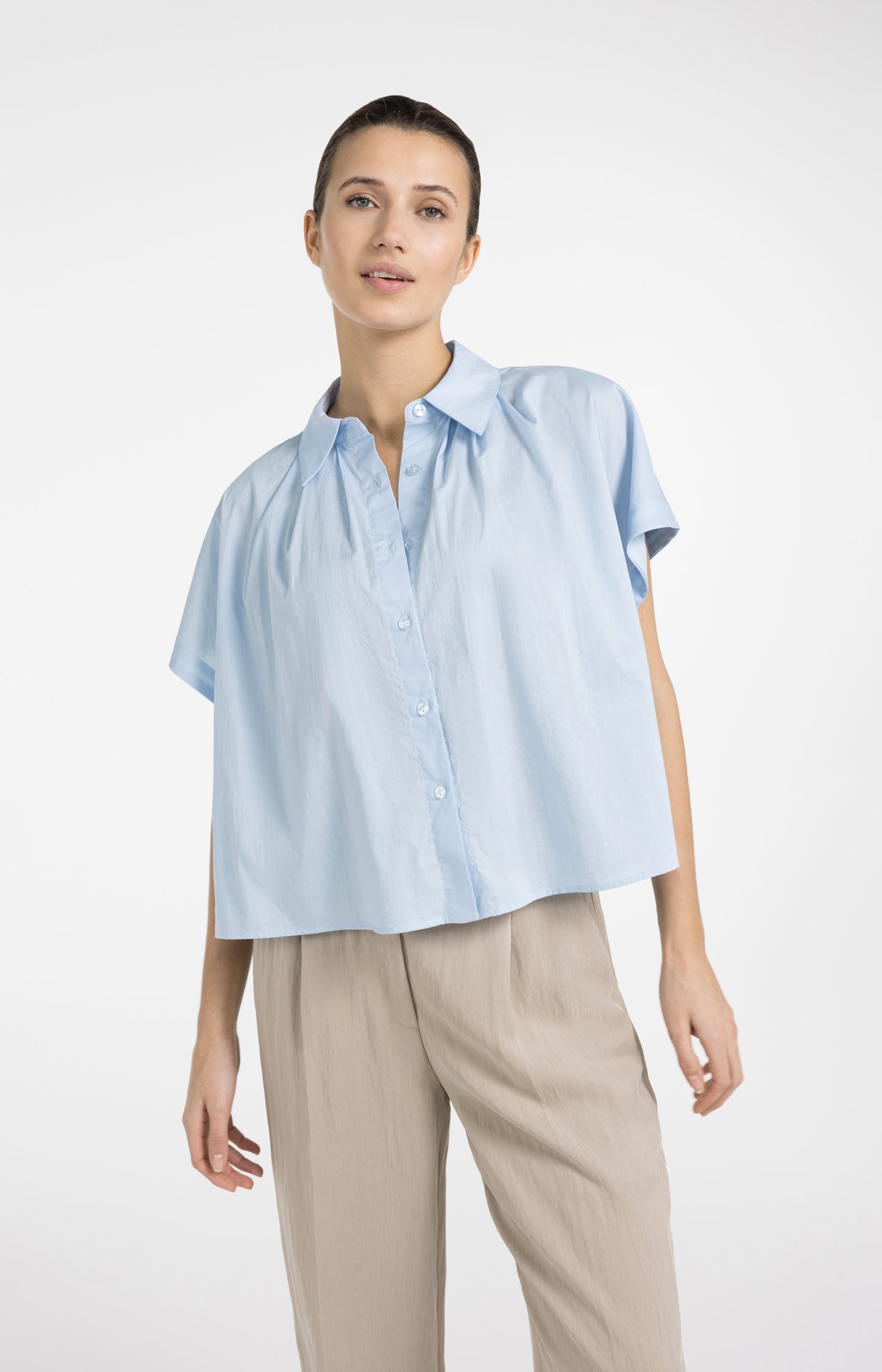 Sleeveless blouse with button details