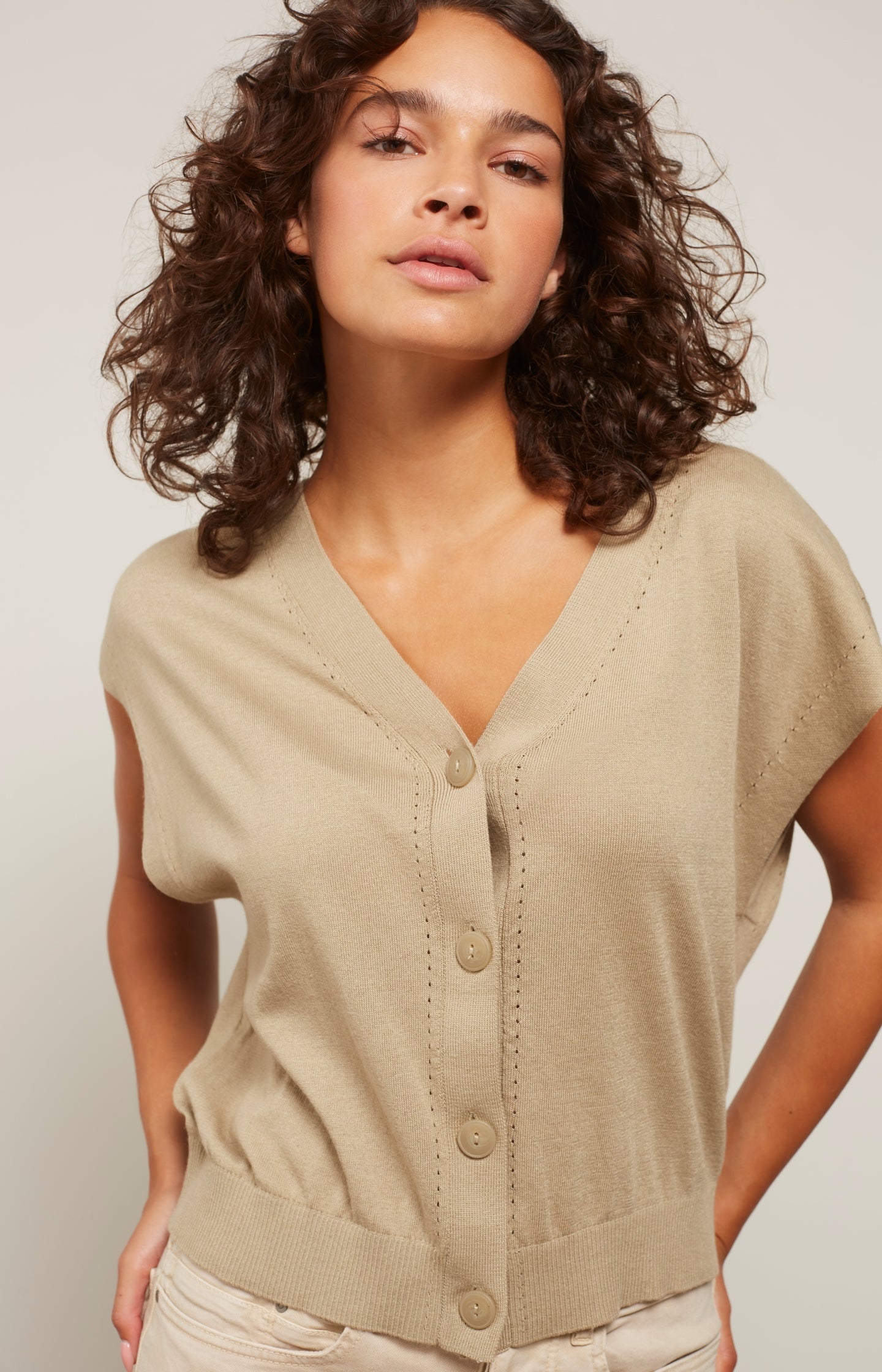 Sleeveless cardigan with V-neck, buttons and stitched detail