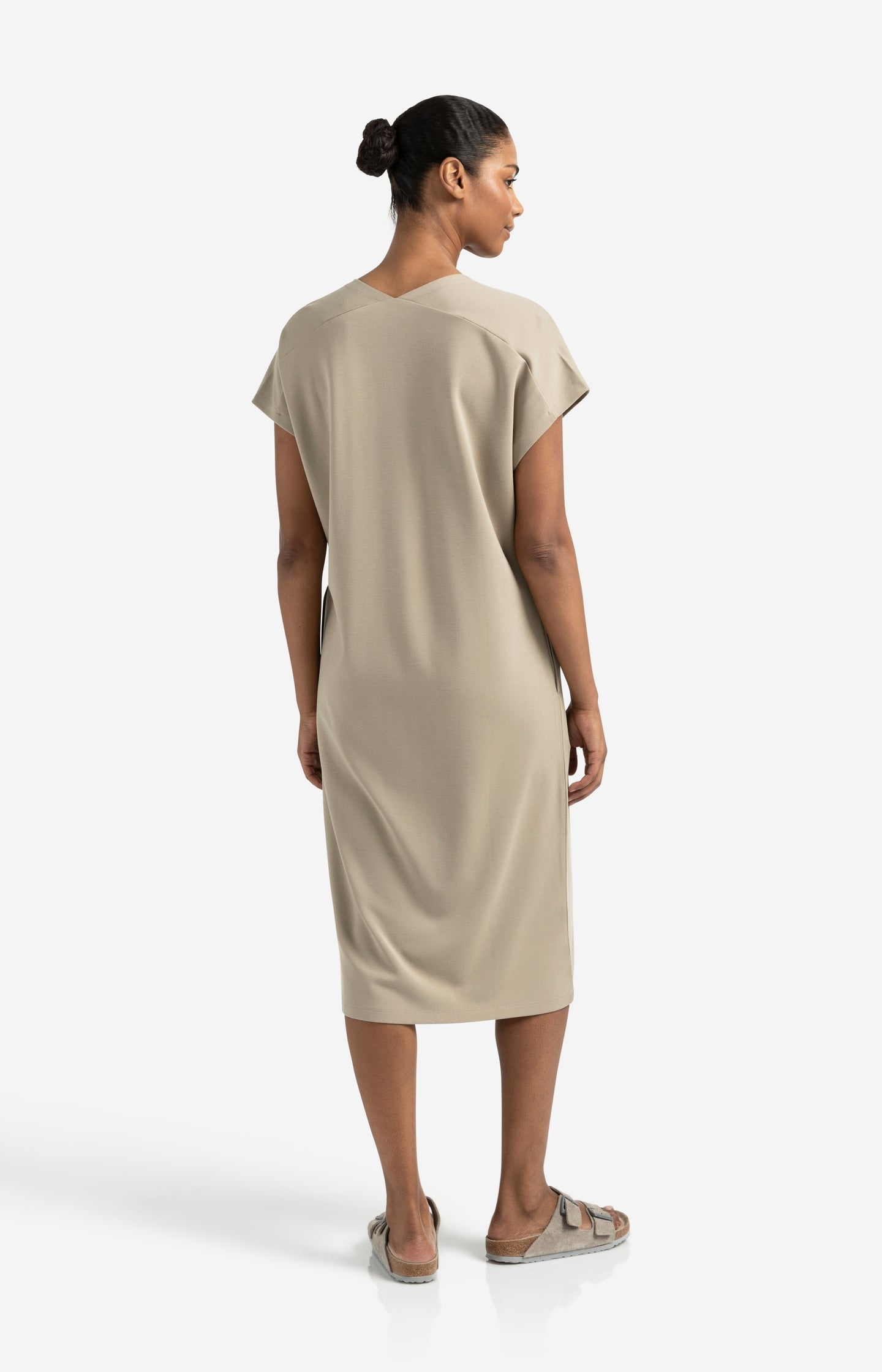 Sleeveless dress with double V-neck and front slit
