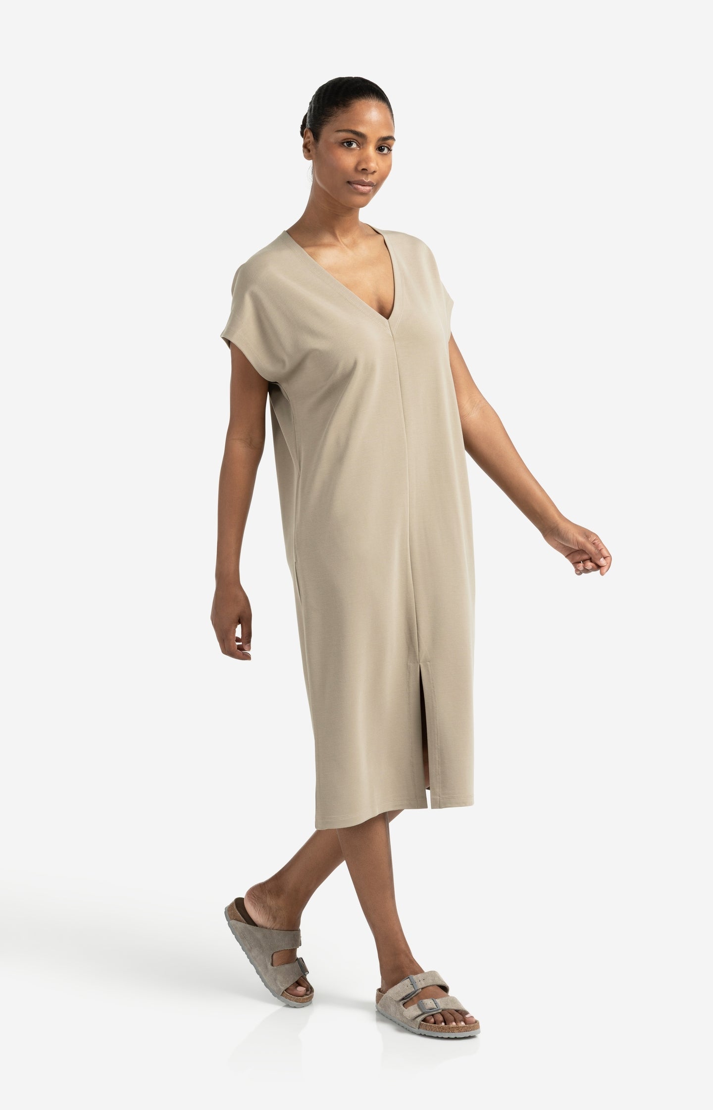 Sleeveless dress with double V-neck and front slit