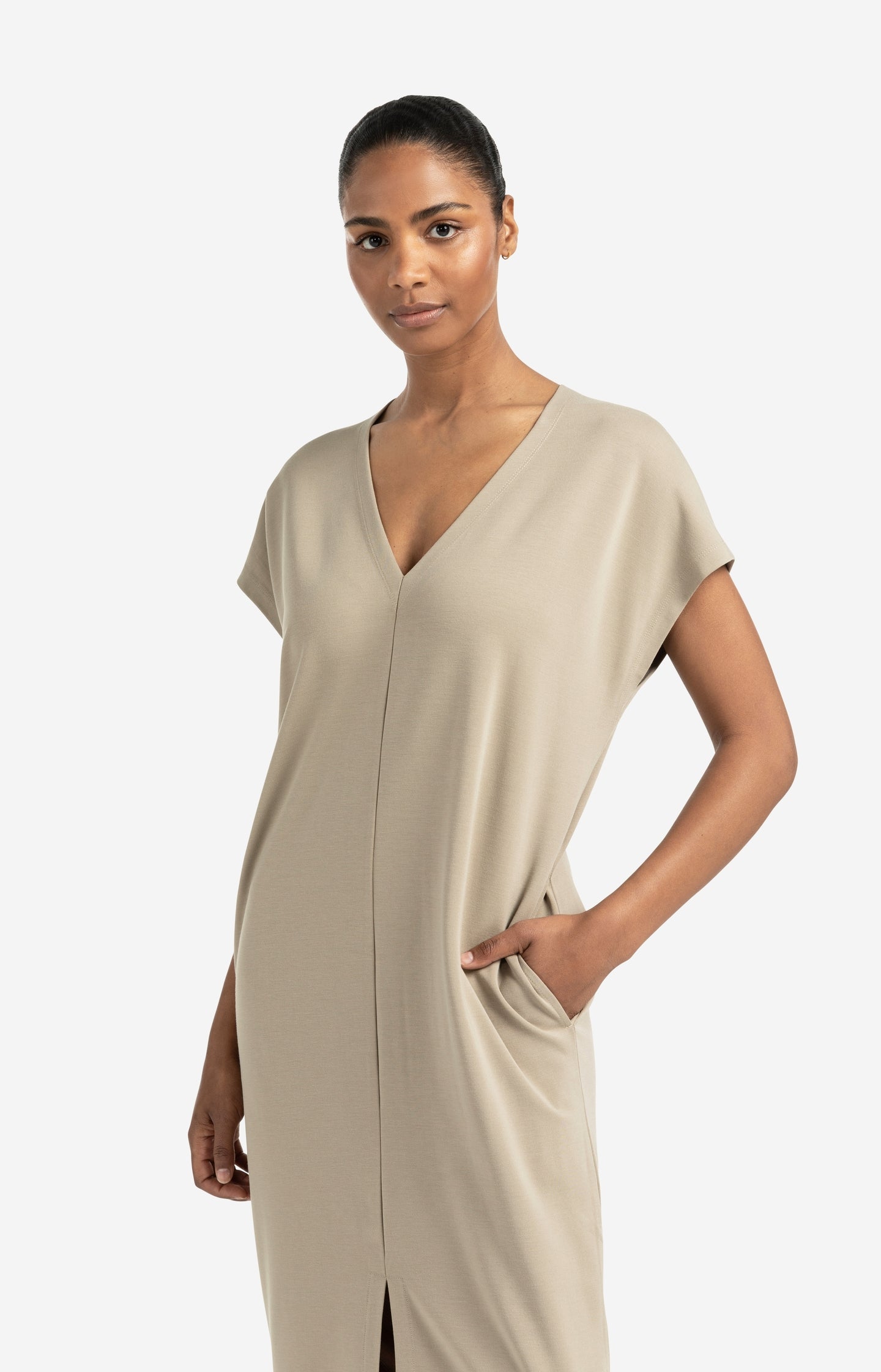 Sleeveless dress with double V-neck and front slit