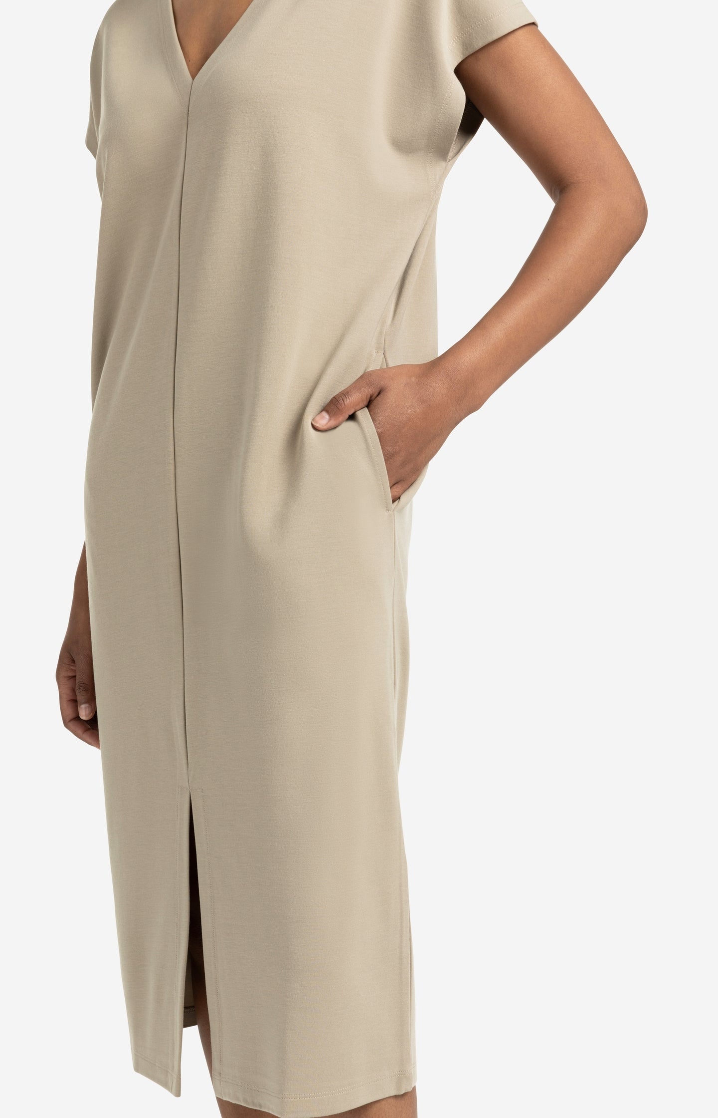 Sleeveless dress with double V-neck and front slit