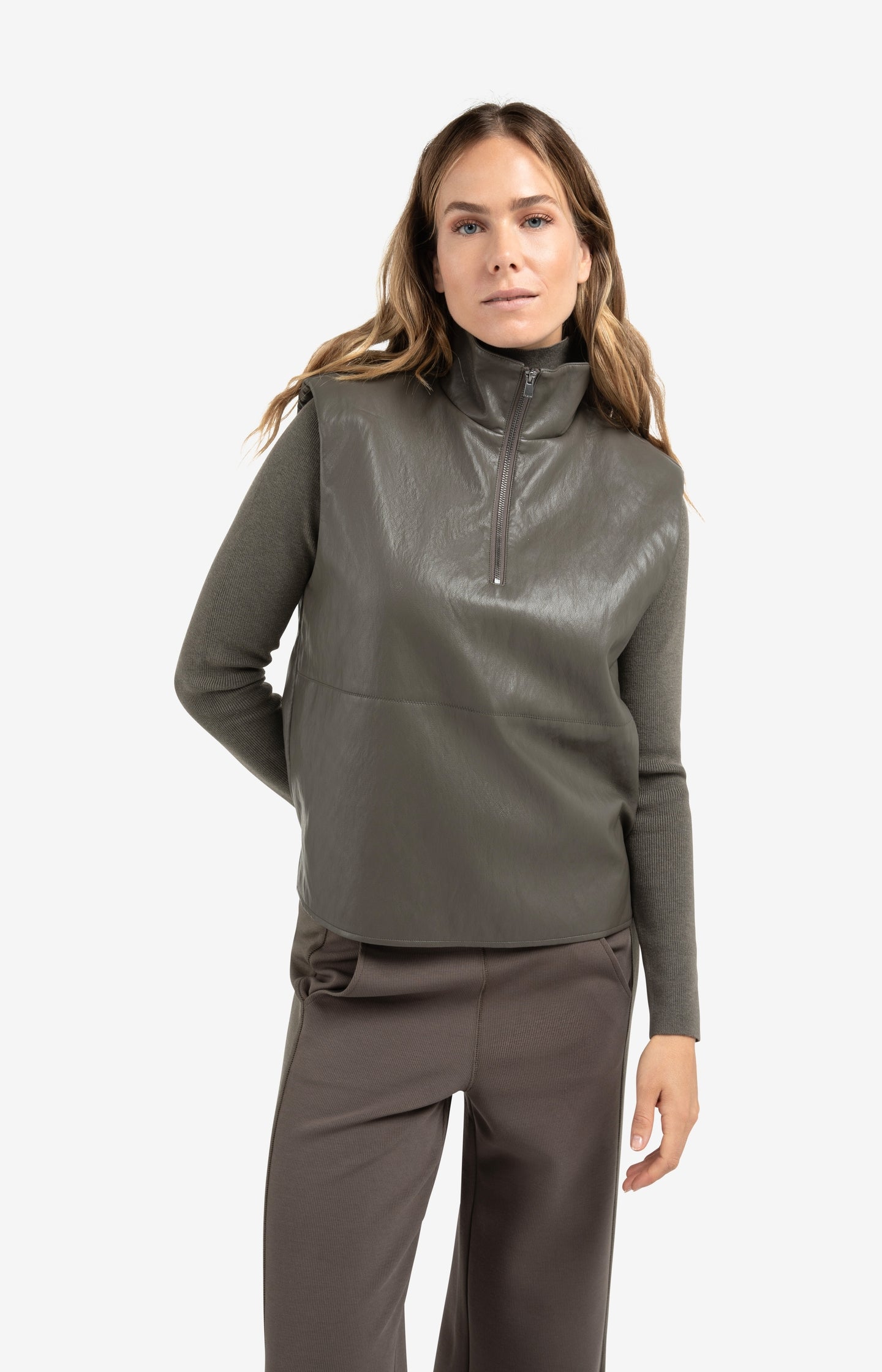 Sleeveless faux leather top with zip collar
