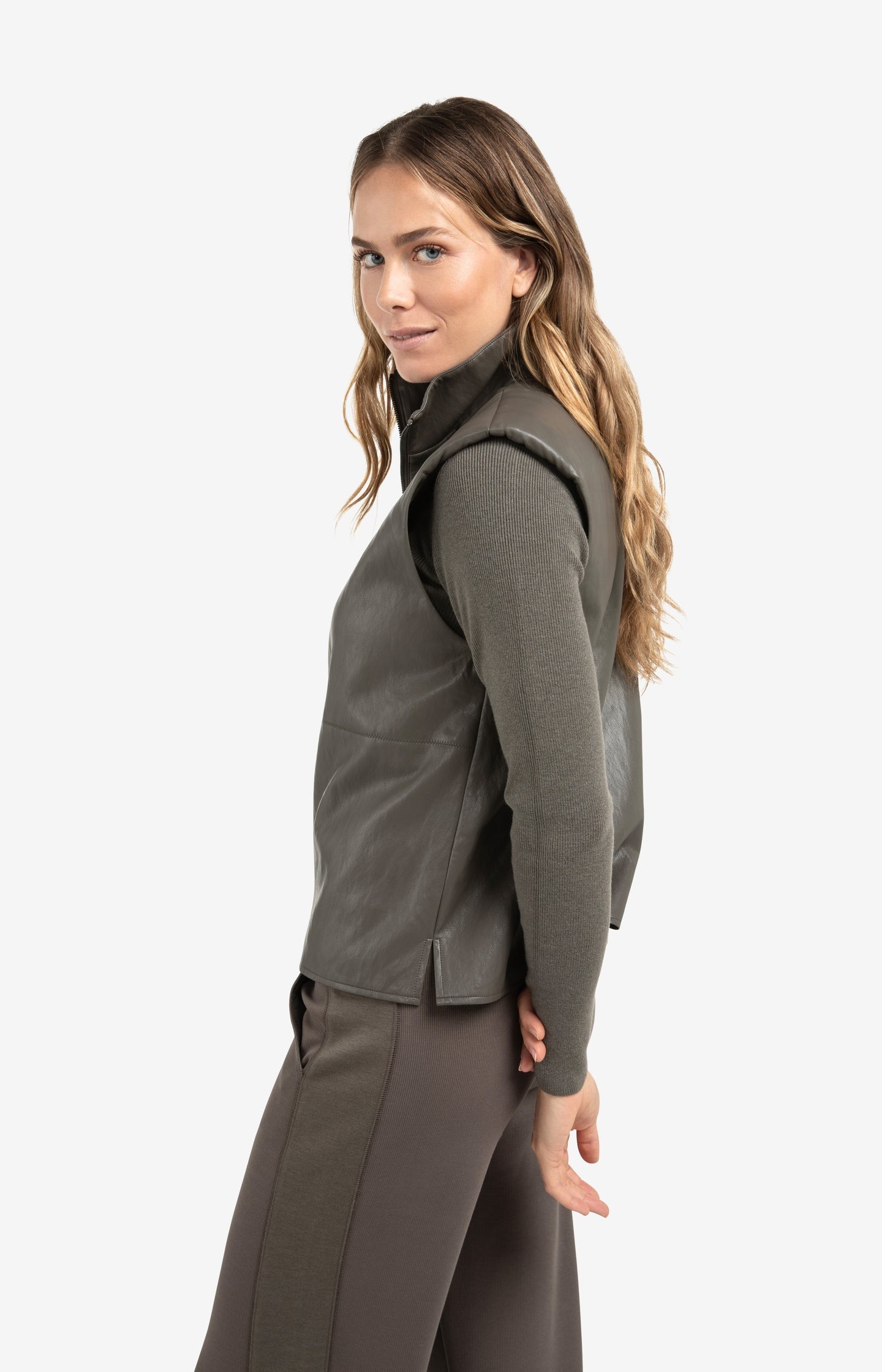 Sleeveless faux leather top with zip collar