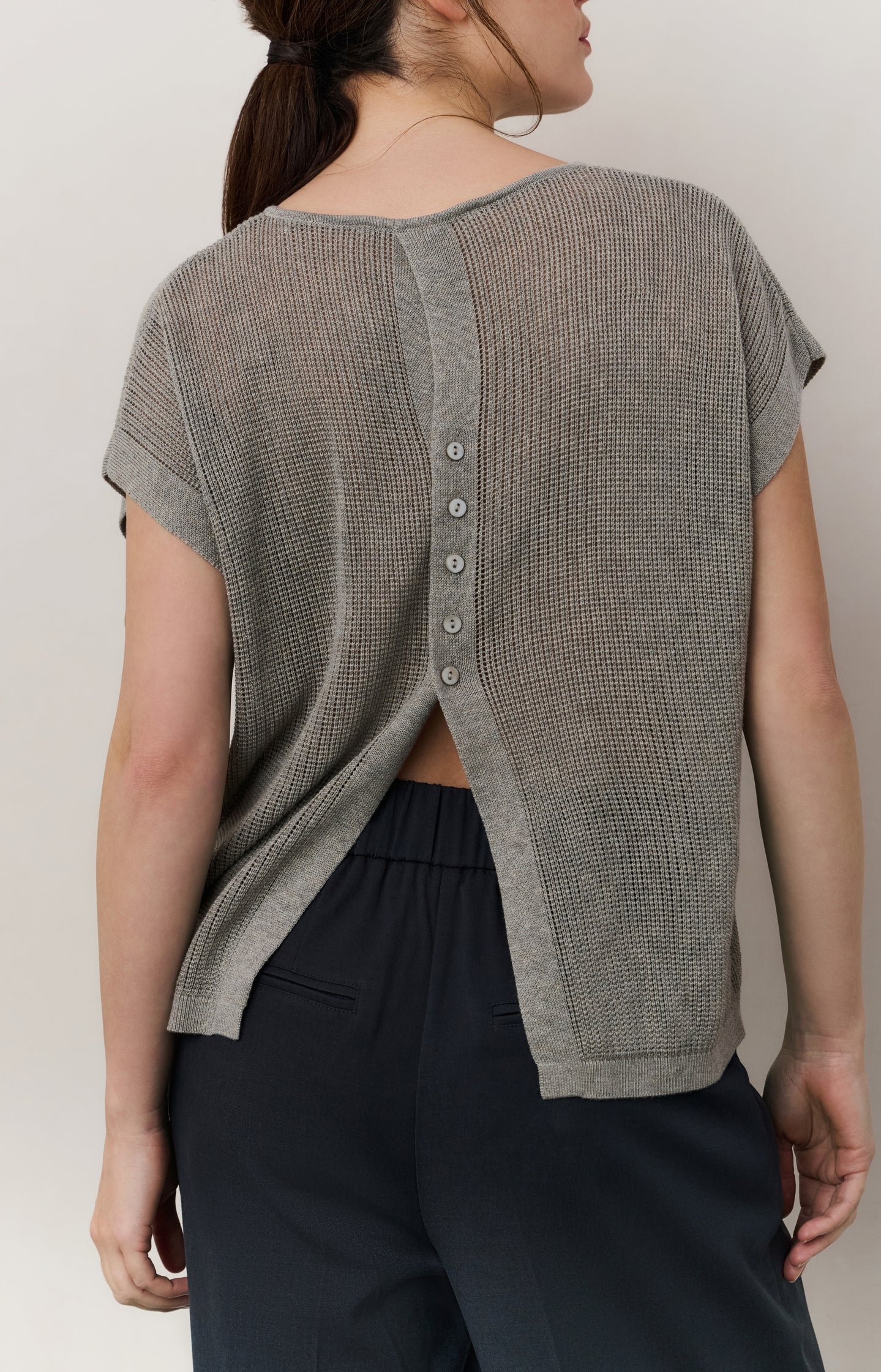 Sleeveless knit top with back button detail