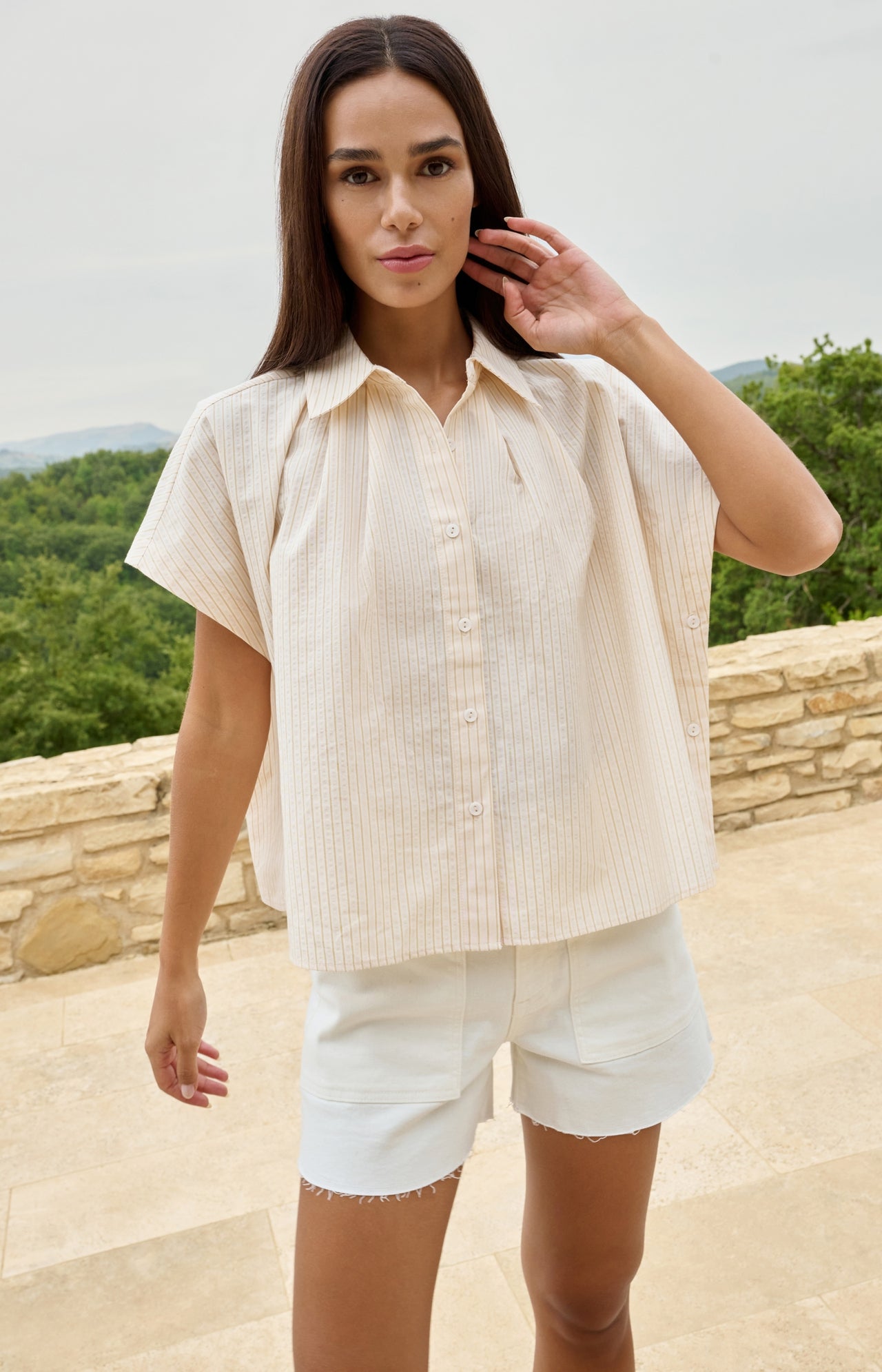 Sleeveless striped blouse with button detail