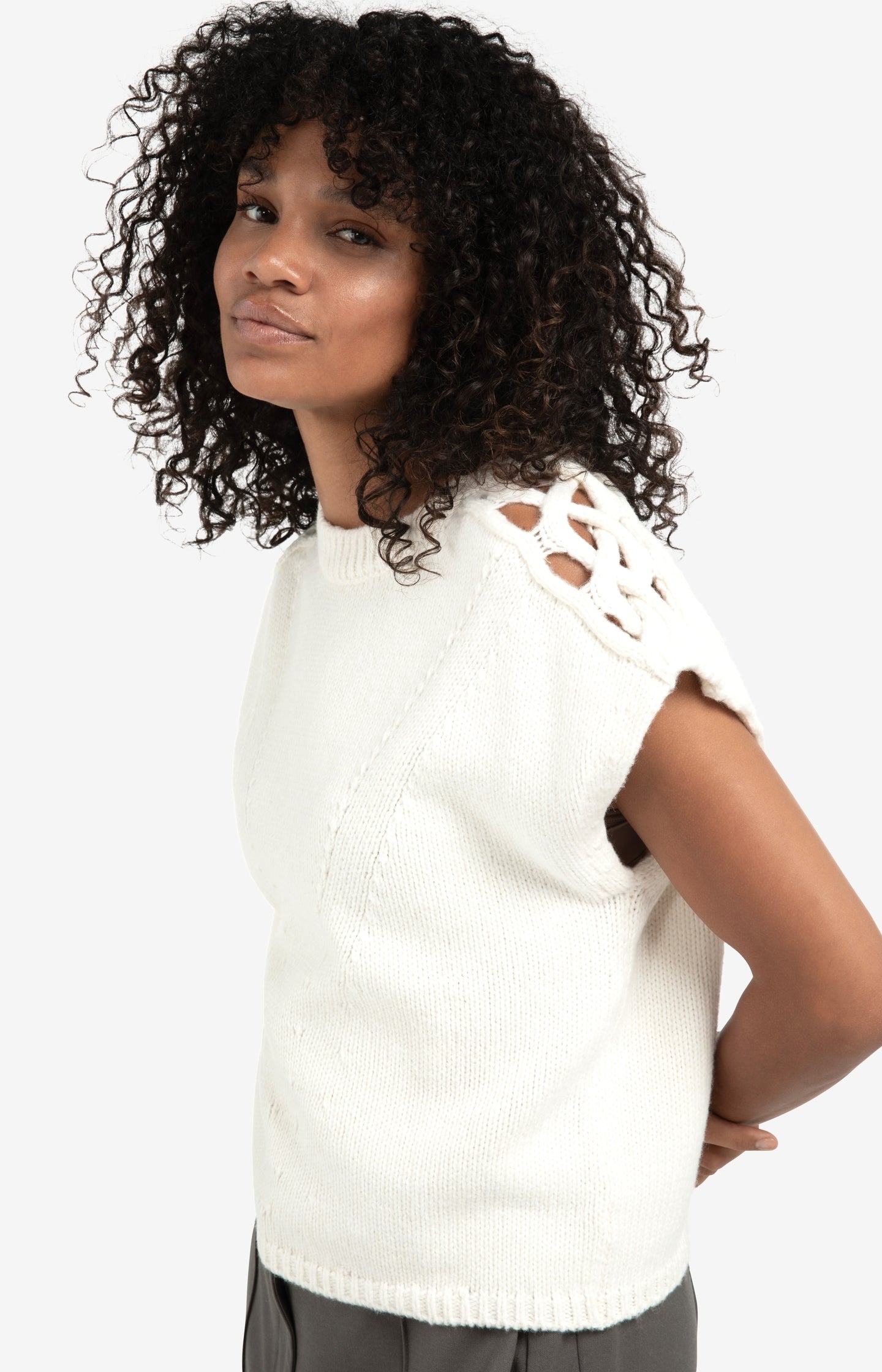 Sleeveless sweater with cable details on the shoulders