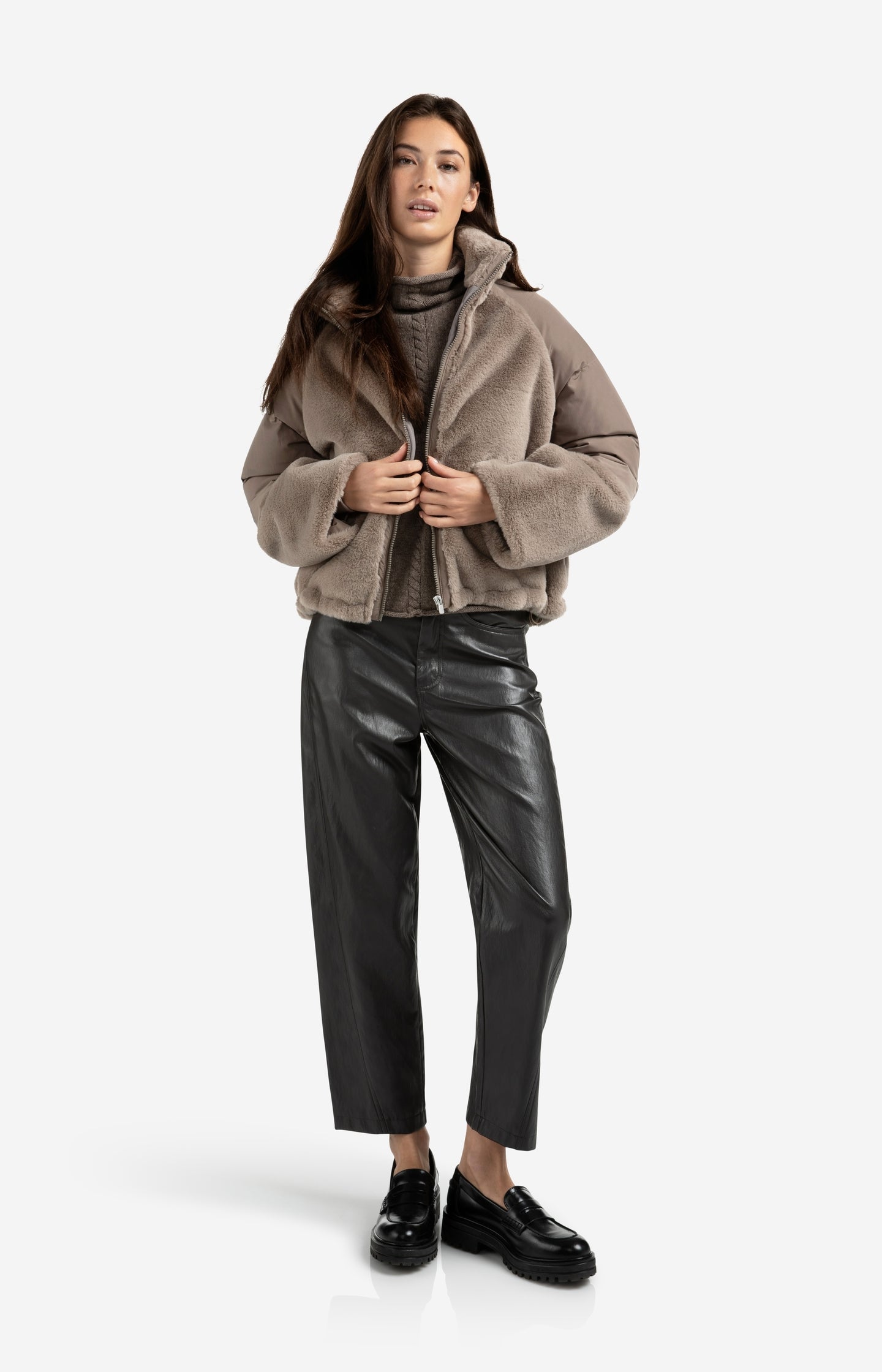 Sleeveless sweater with high neck and cable detail