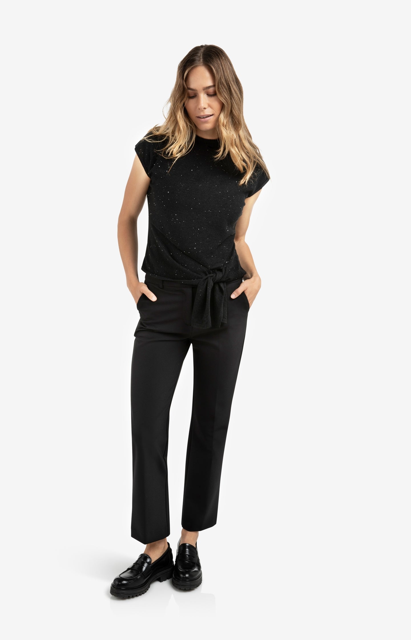 Sleeveless sweater with knot detail and subtle sequins