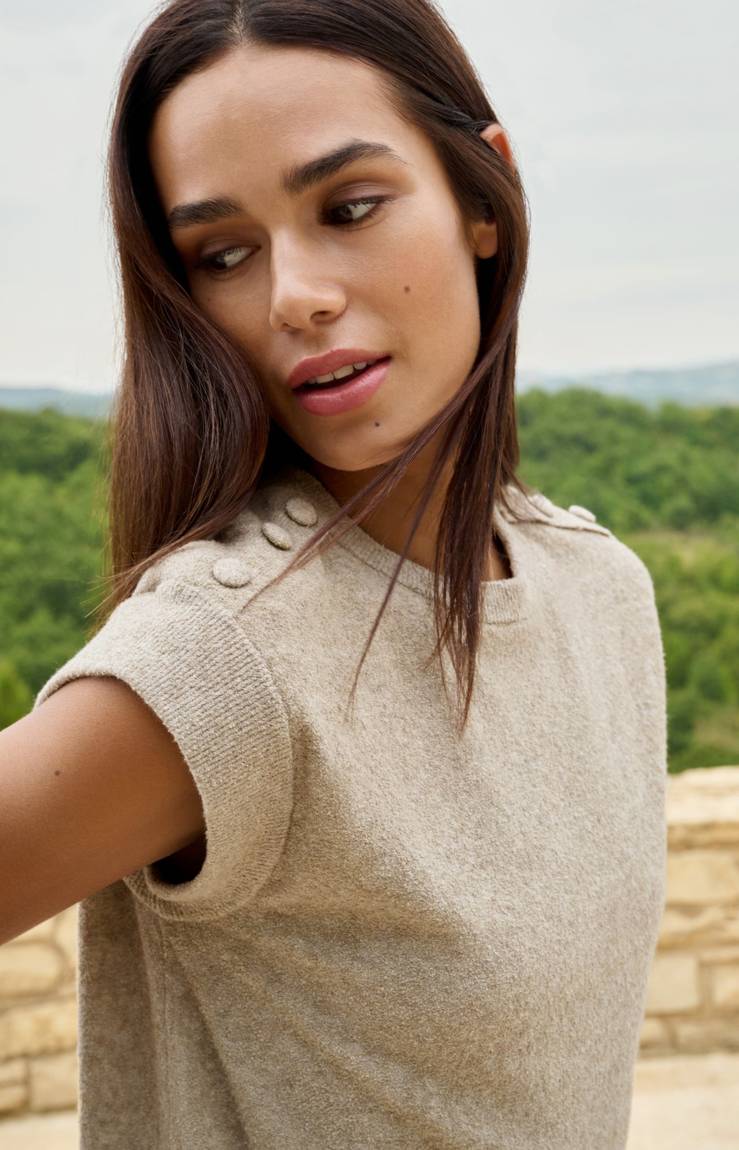 Sleeveless sweater with shoulder button details