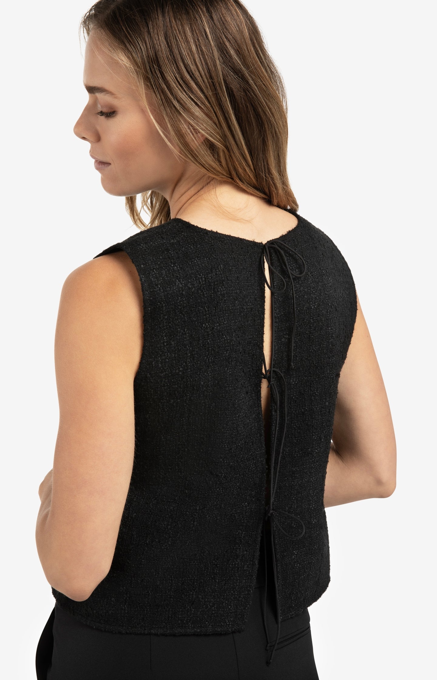 Sleeveless top with bow details on the back