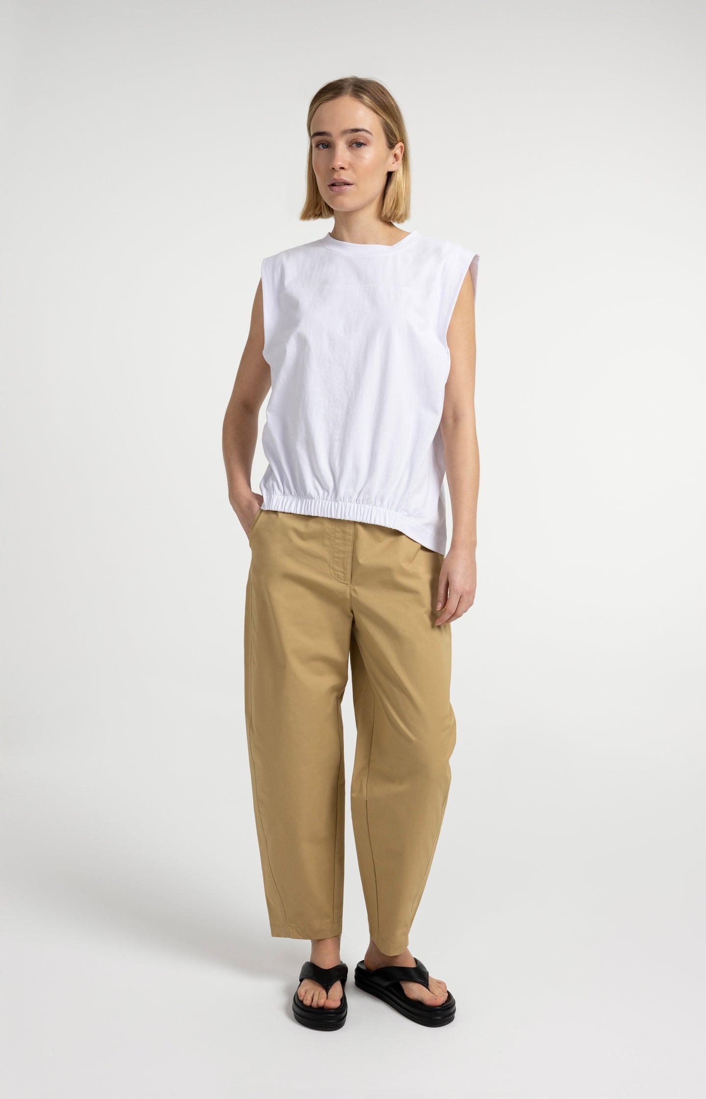Sleeveless top with elastic hem