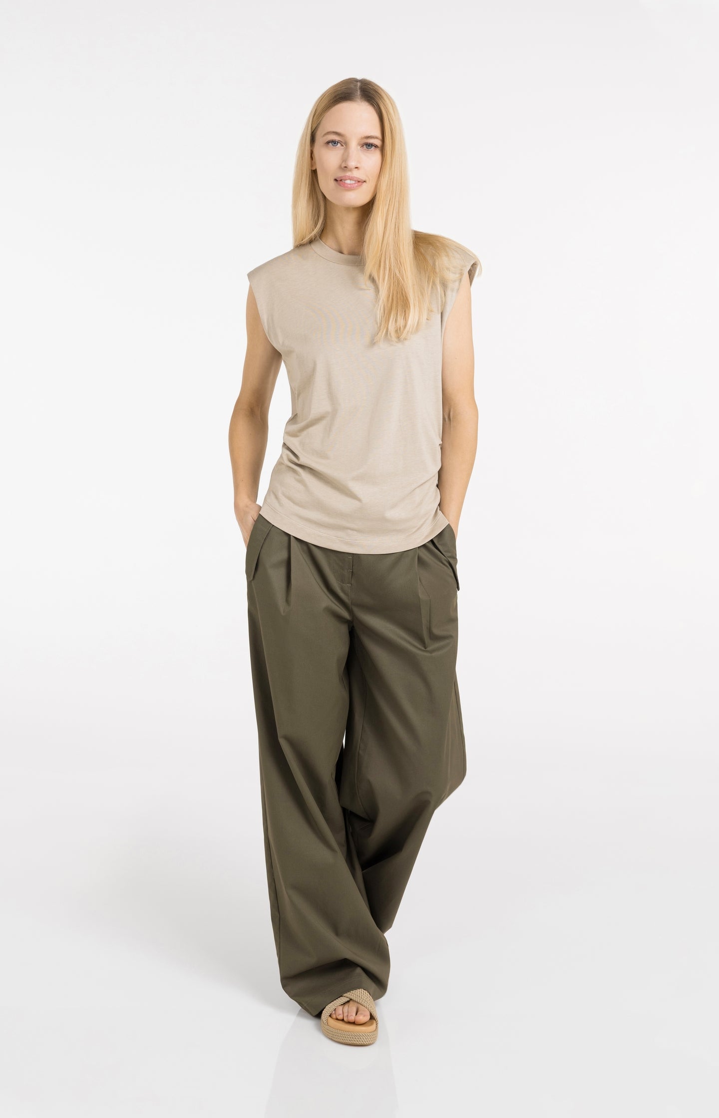 Sleeveless top with pleated sideseams