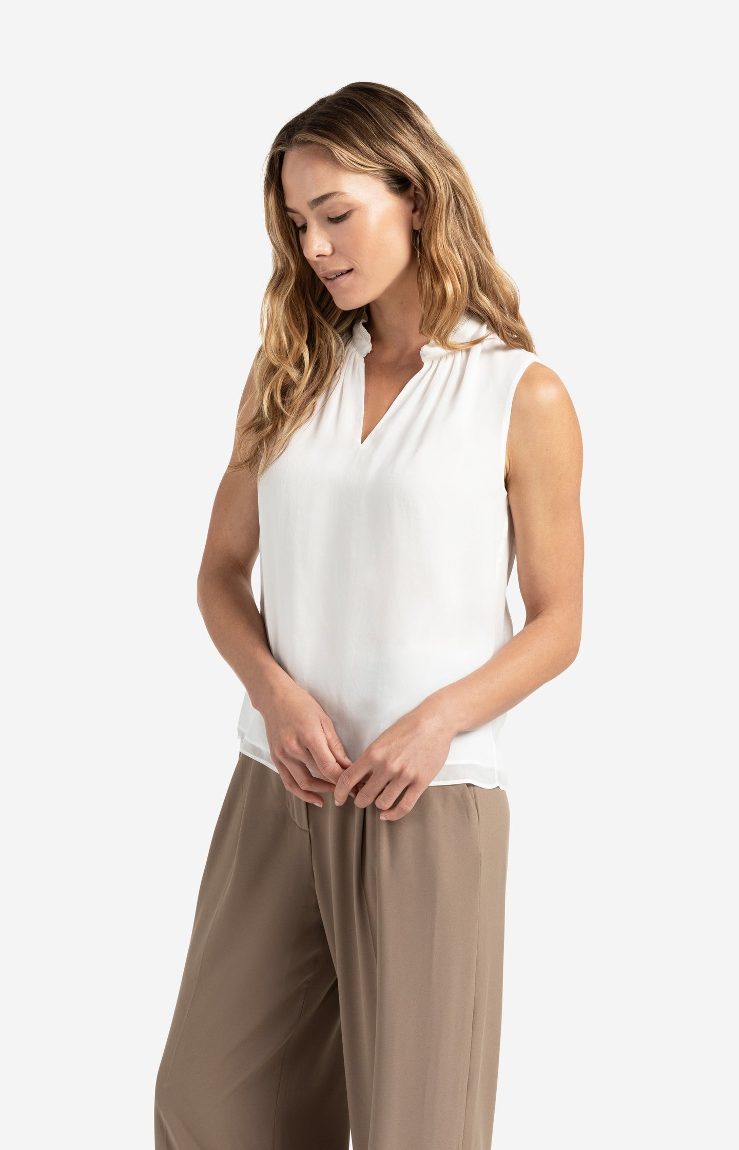 Sleeveless top with ruffled collar and keyhole detail