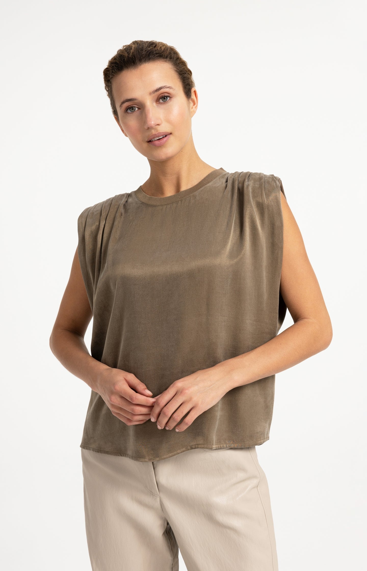 Sleeveless top with shoulder pleats