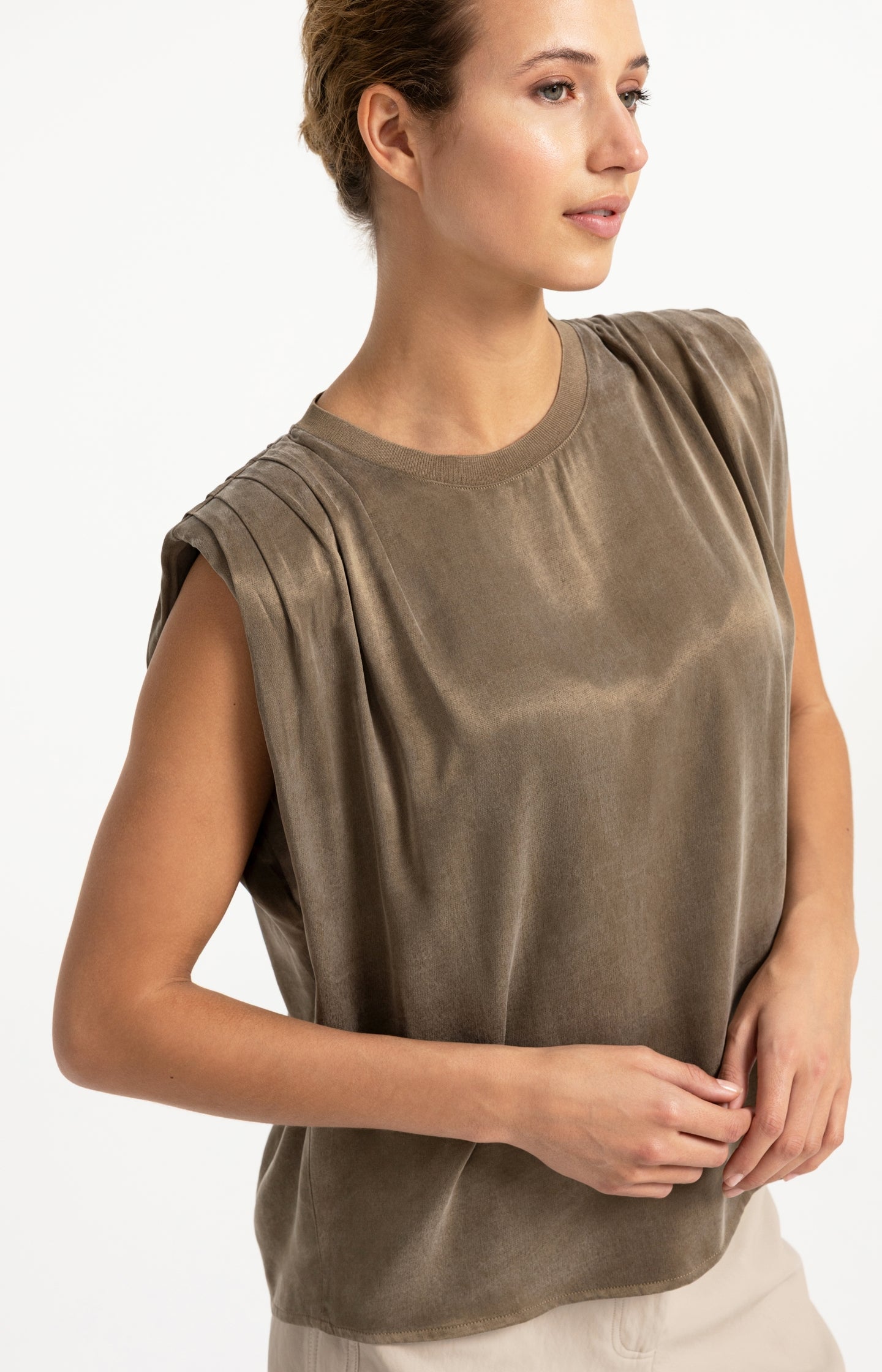 Sleeveless top with shoulder pleats
