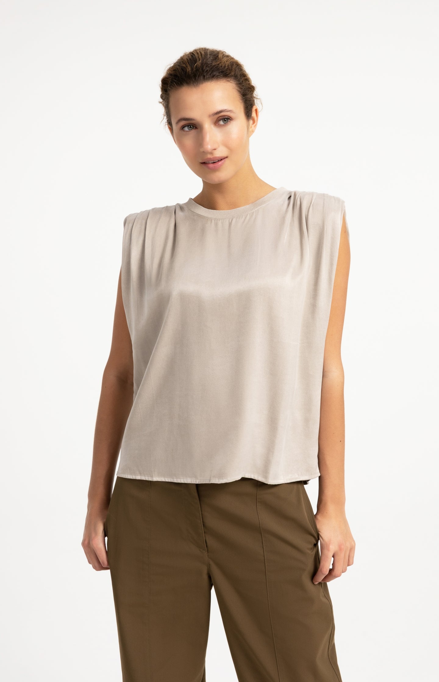 Sleeveless top with shoulder pleats