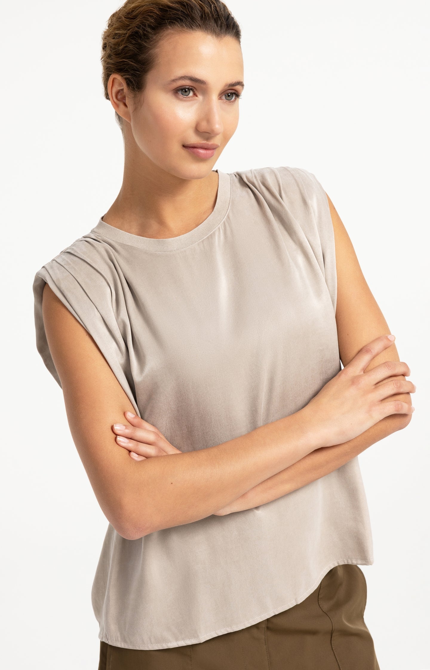 Sleeveless top with shoulder pleats