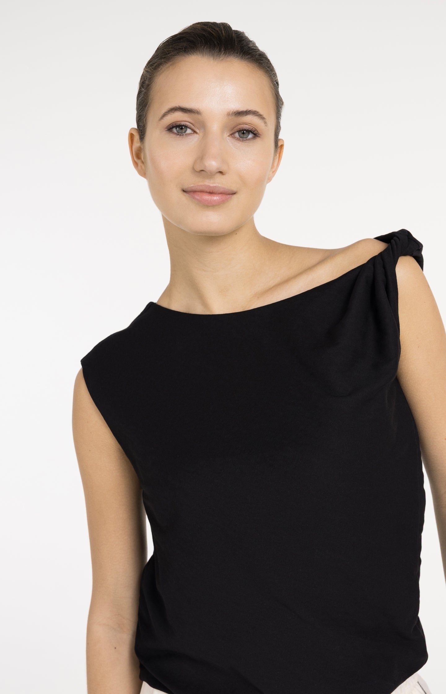 Sleeveless top with twisted shoulder detail