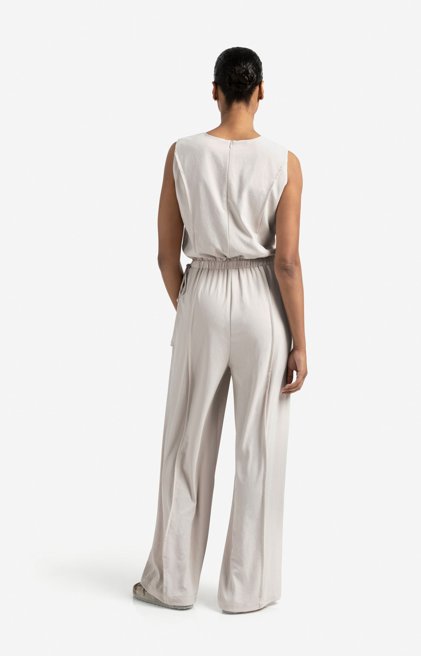 Sleeveless woven jumpsuit with cord detail