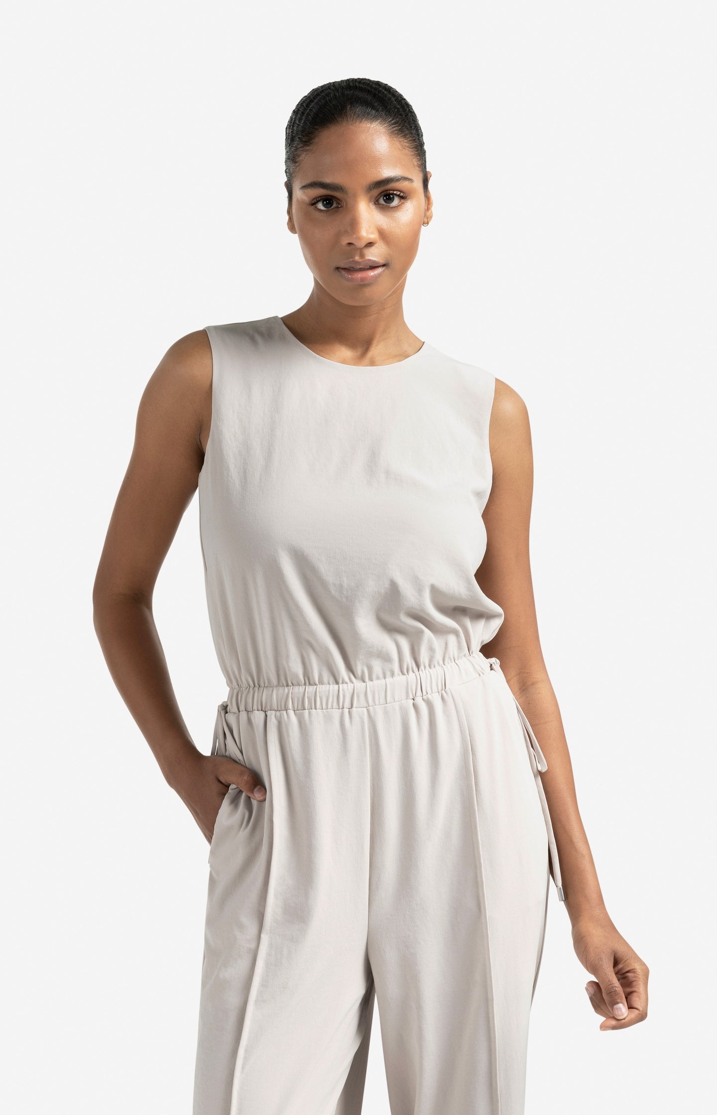 Sleeveless woven jumpsuit with cord detail
