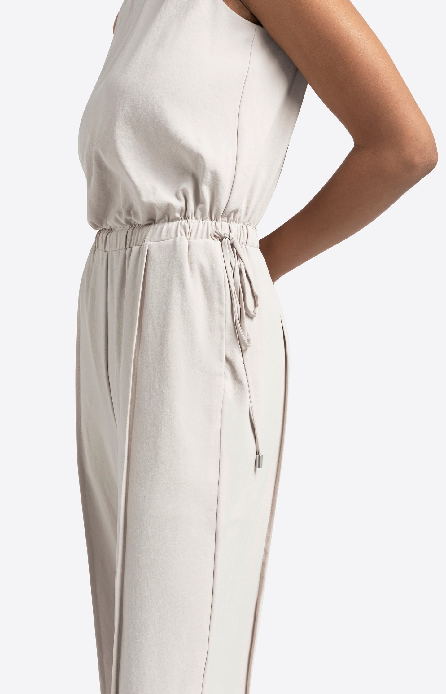 Sleeveless woven jumpsuit with cord detail