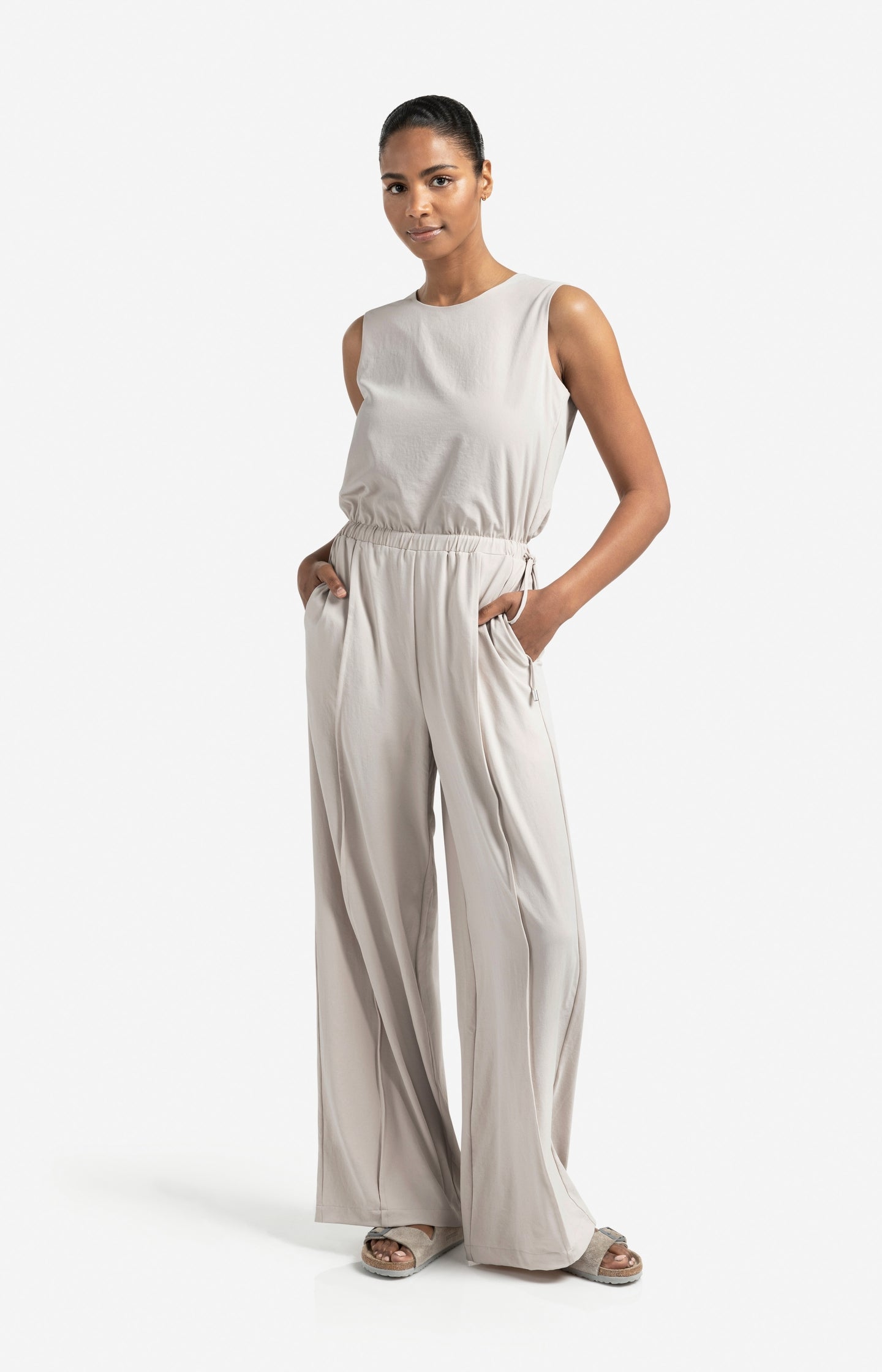 Sleeveless woven jumpsuit with cord detail