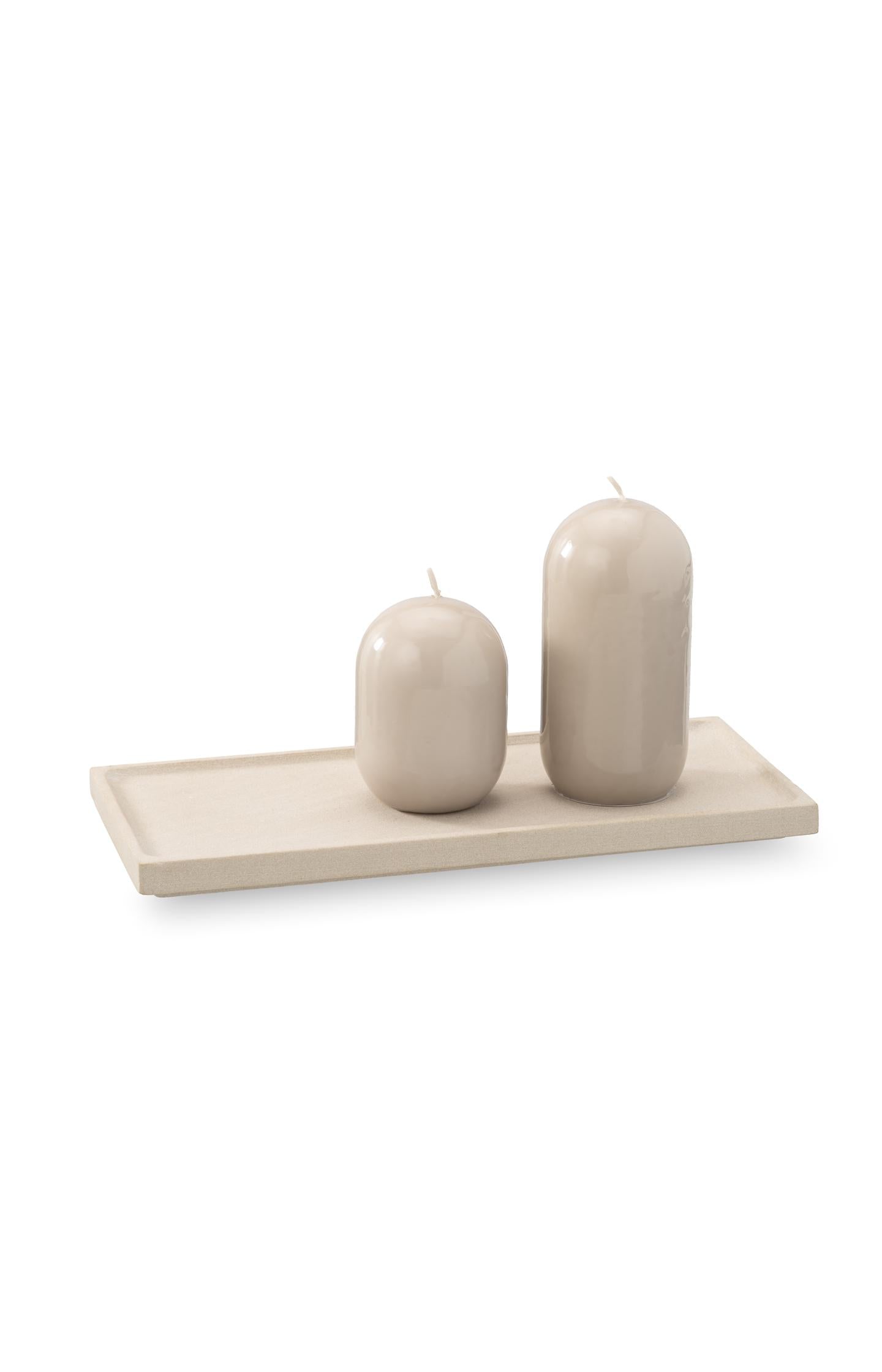 Small glossy capsule candle