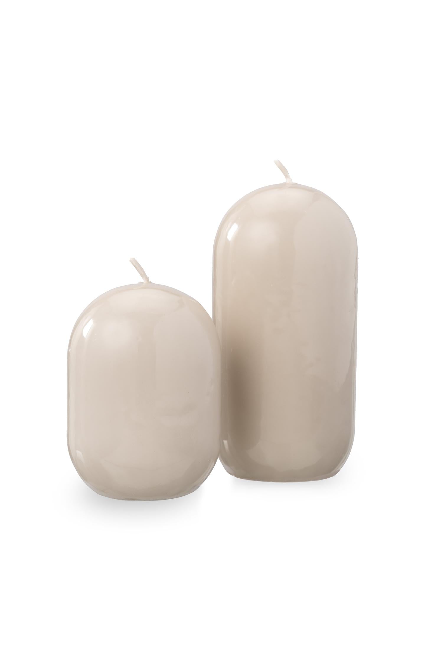 Small glossy capsule candle