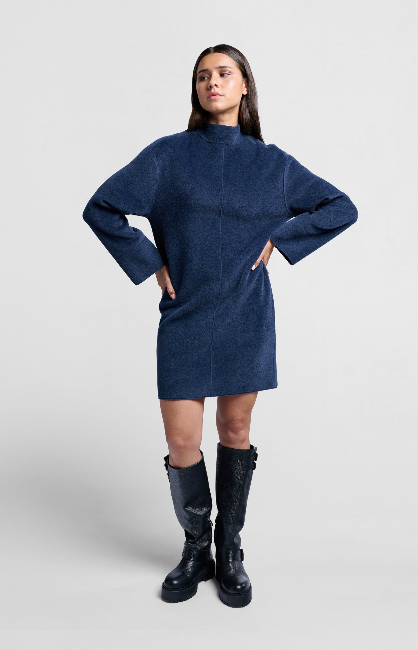 Soft dark blue dress with high neck and wide sleeves