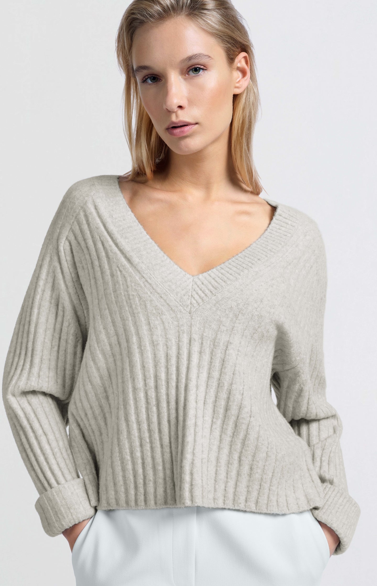 Soft ribbed sweater with V-neck and long sleeves