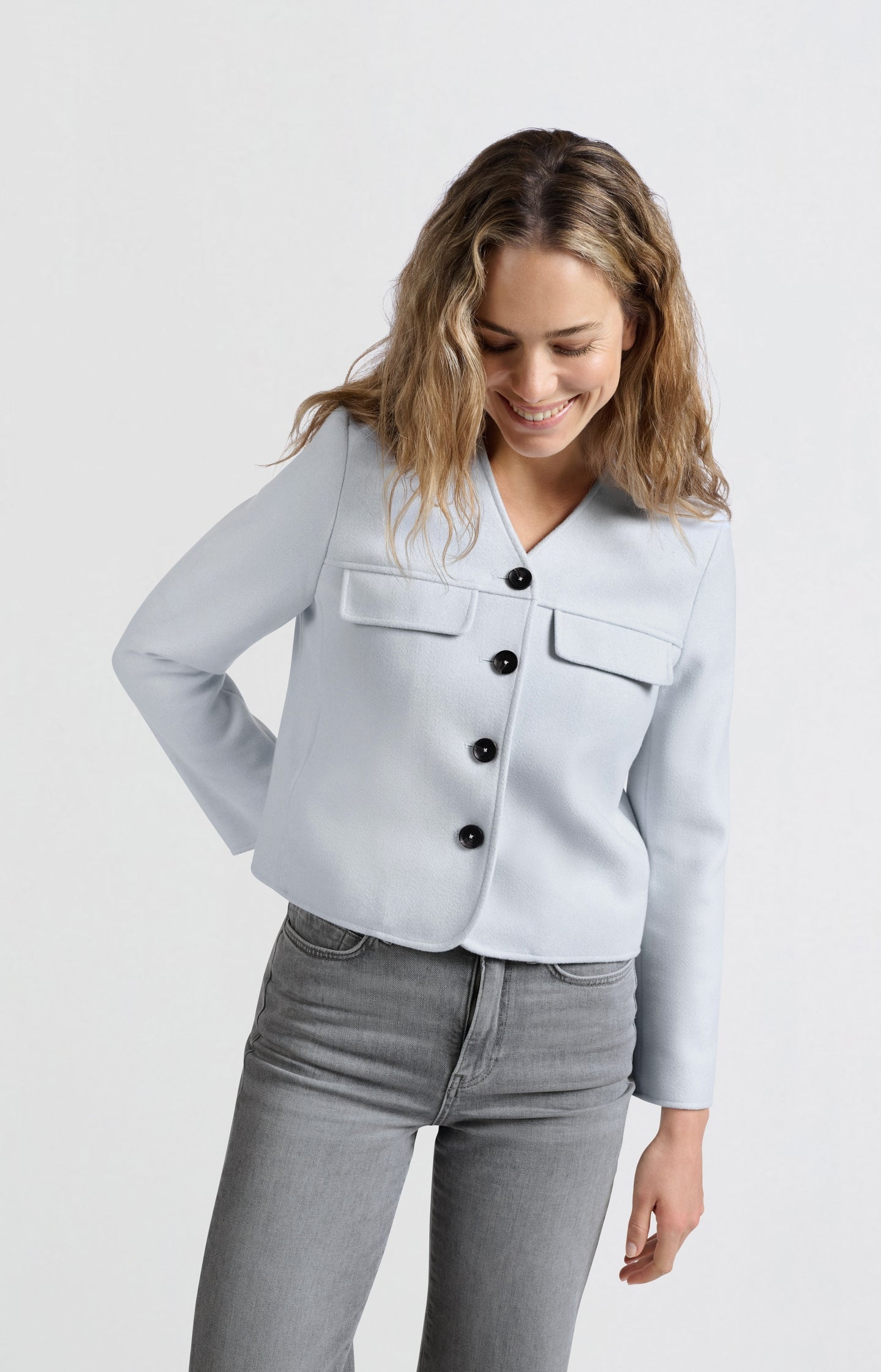 Soft short jacket with chest pockets and button closure