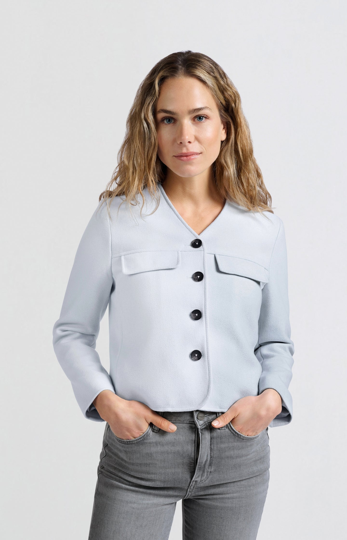 Soft short jacket with chest pockets and button closure