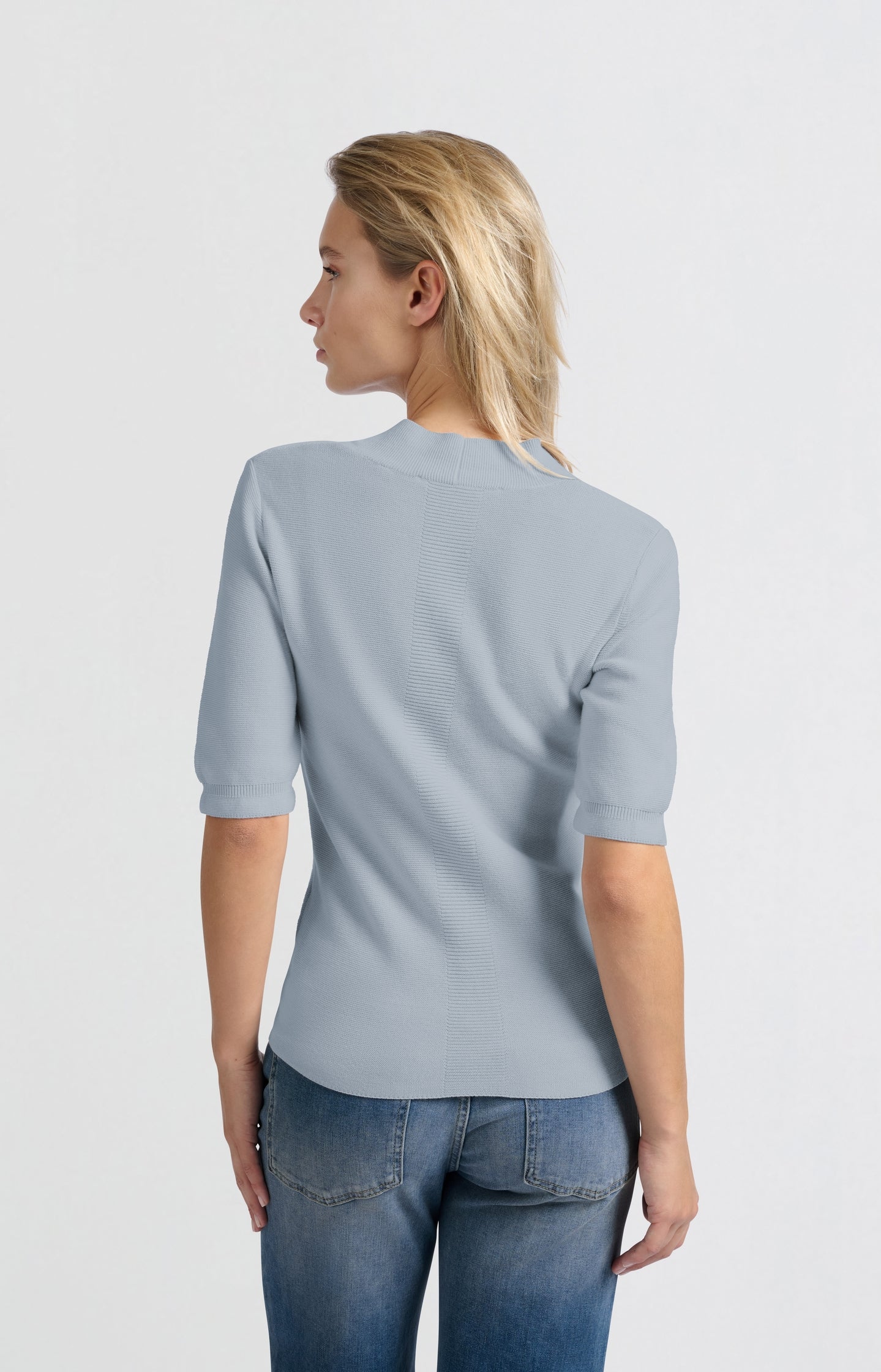 Soft sweater with deep V-neck and short sleeves