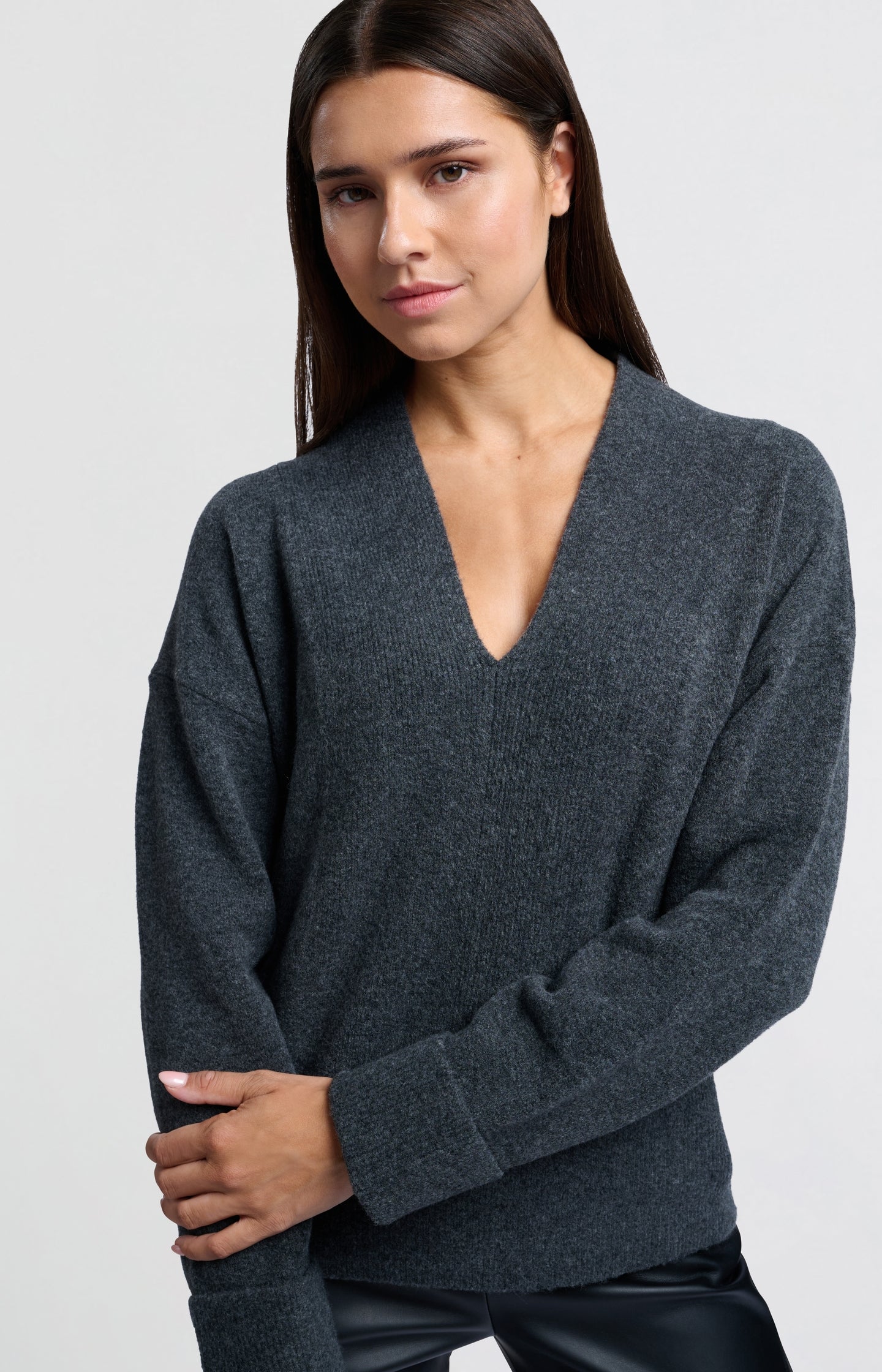 Soft sweater with deep V-neck and subtle rib details