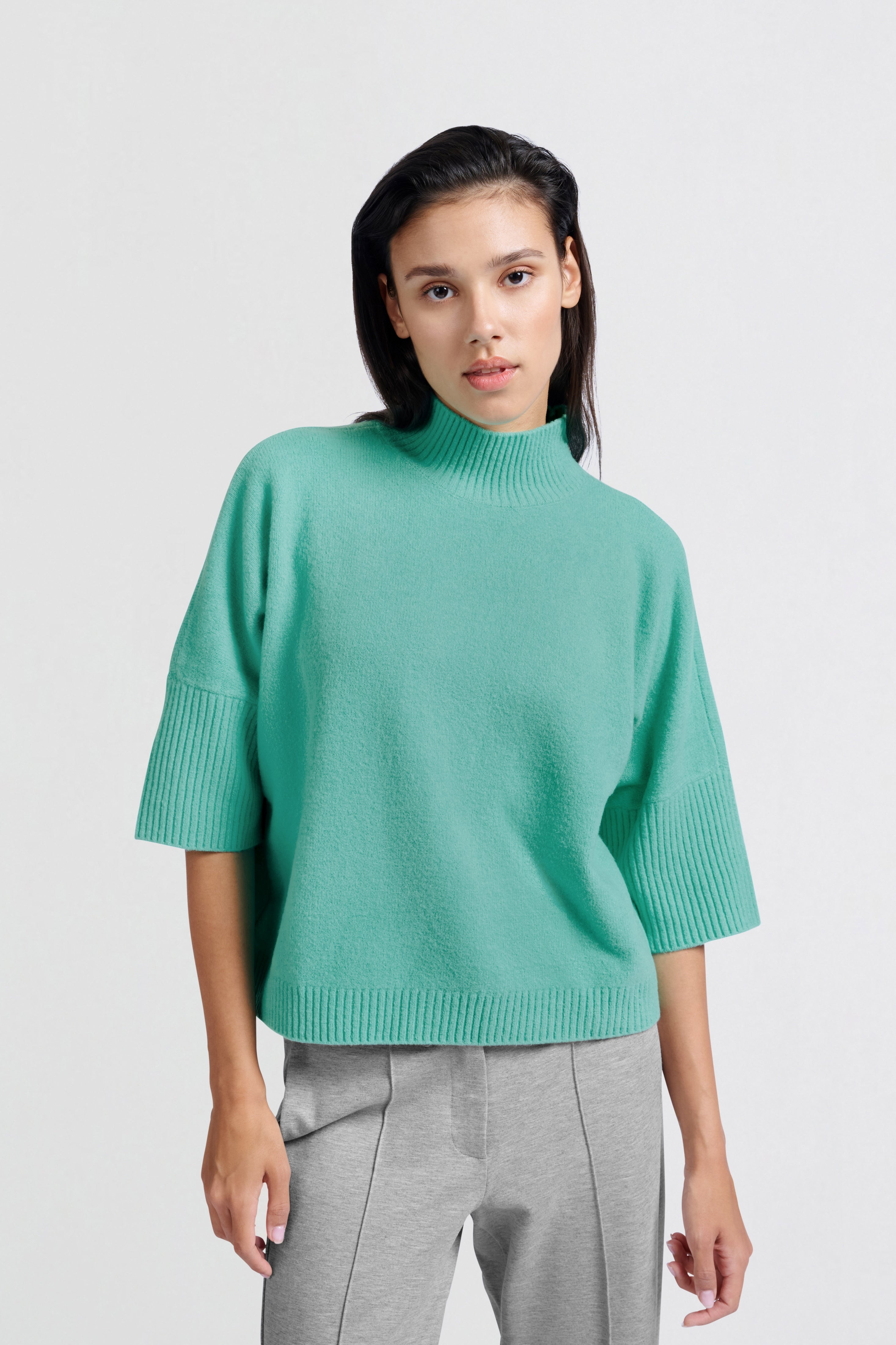 Soft sweater with high neck and three-quarter sleeves