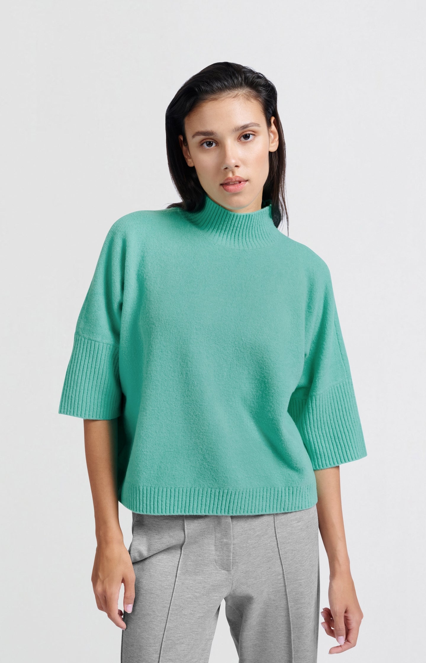 Soft sweater with high neck and three-quarter sleeves
