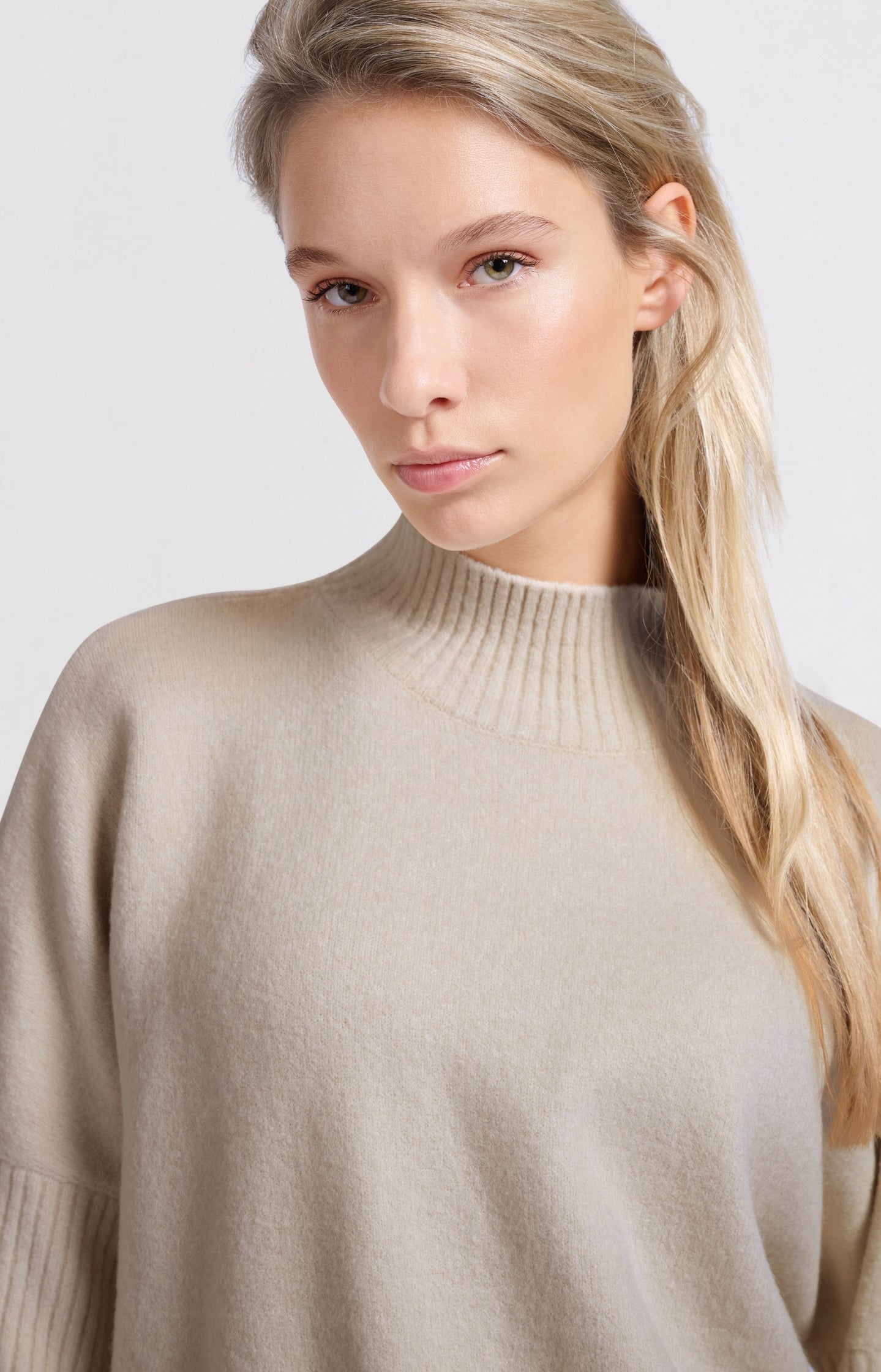 Soft sweater with high neck and three-quarter sleeves