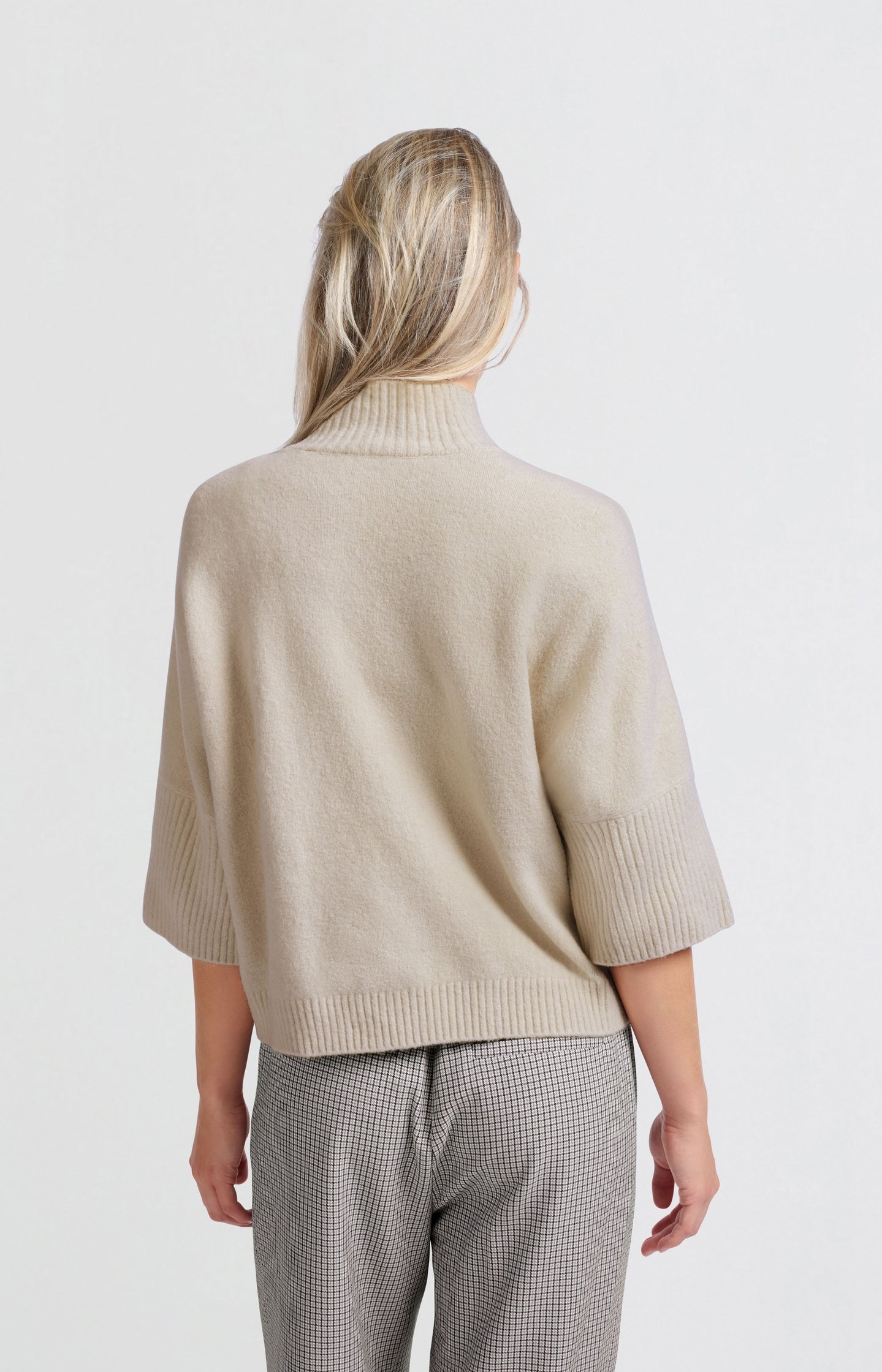 Soft sweater with high neck and three-quarter sleeves