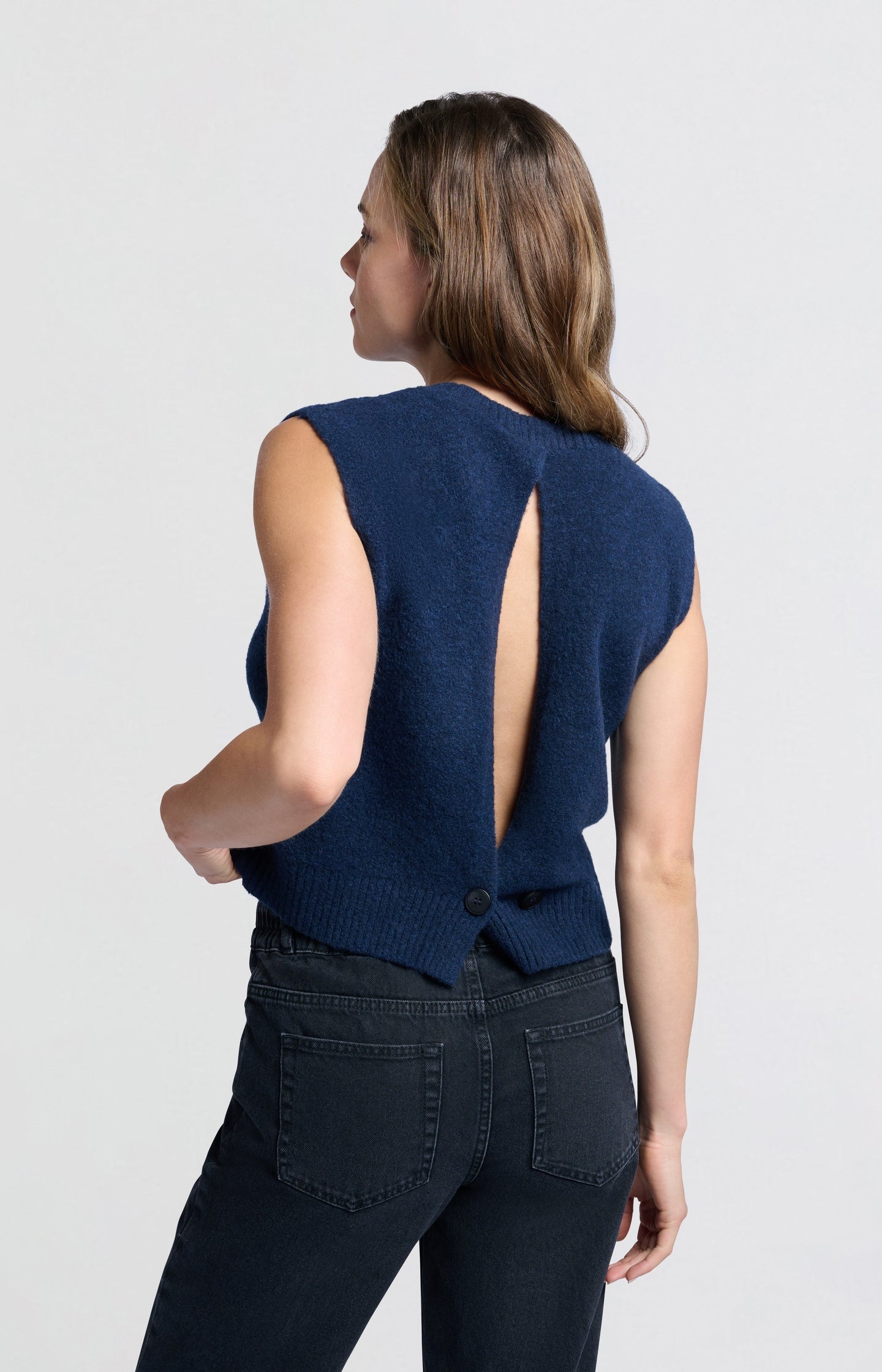 Soft vest with elegant open back and button closure