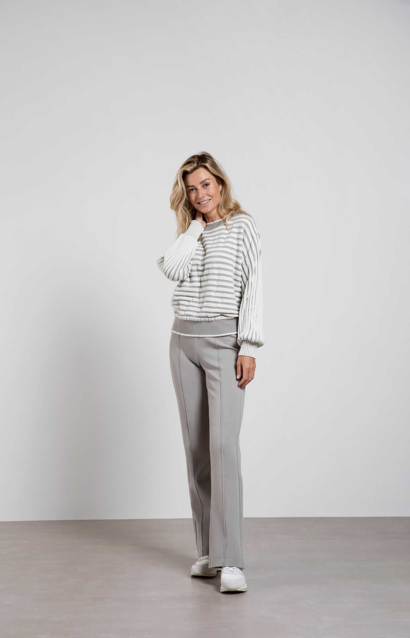 Striped sweater with crewneck, long sleeves and frayed seams